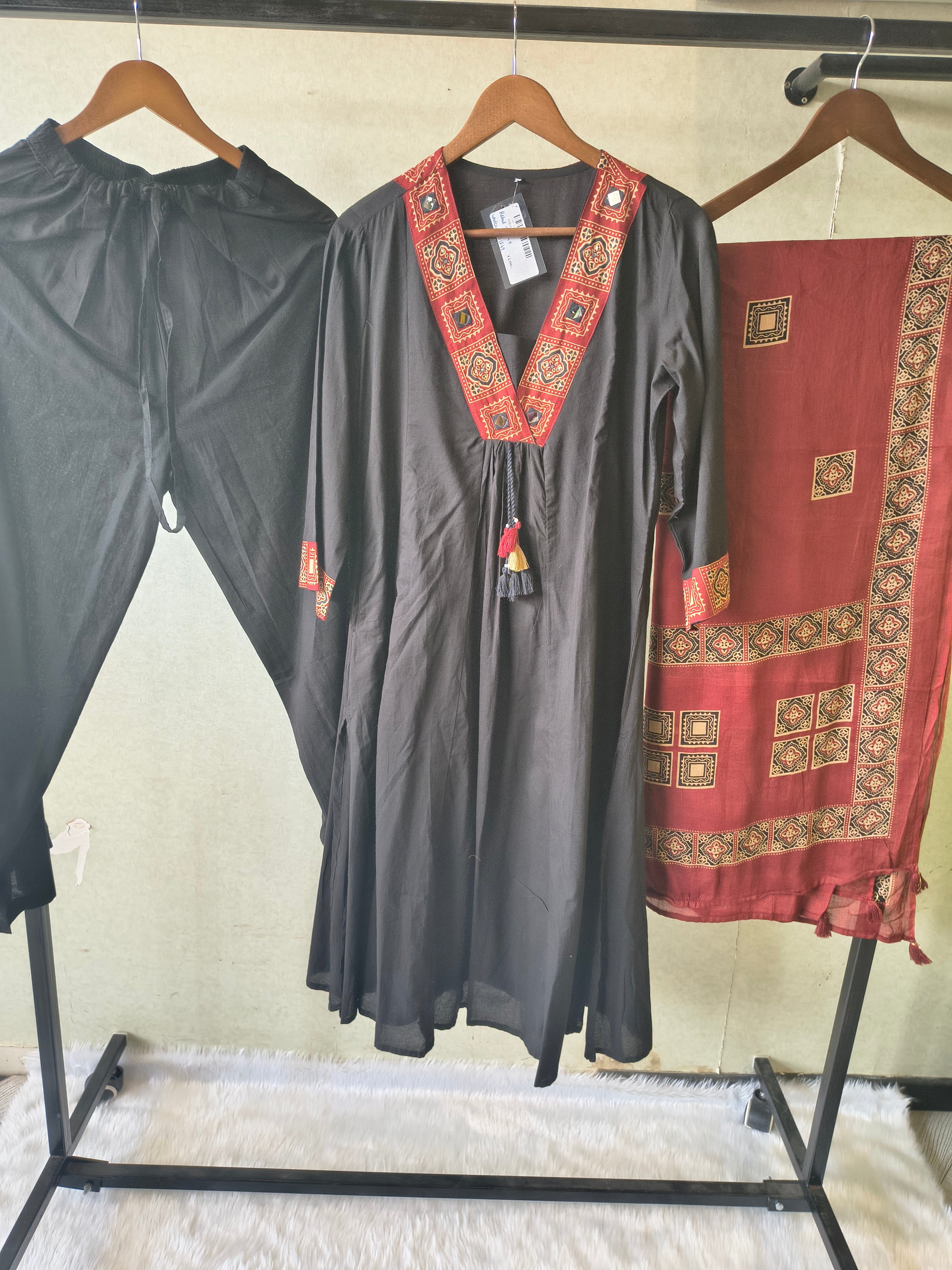 Image of Black Cotton Blend 3-Piece Suit Set with Tribal Printed V-Neck, Tassel Tie-Up & Printed Dupatta
