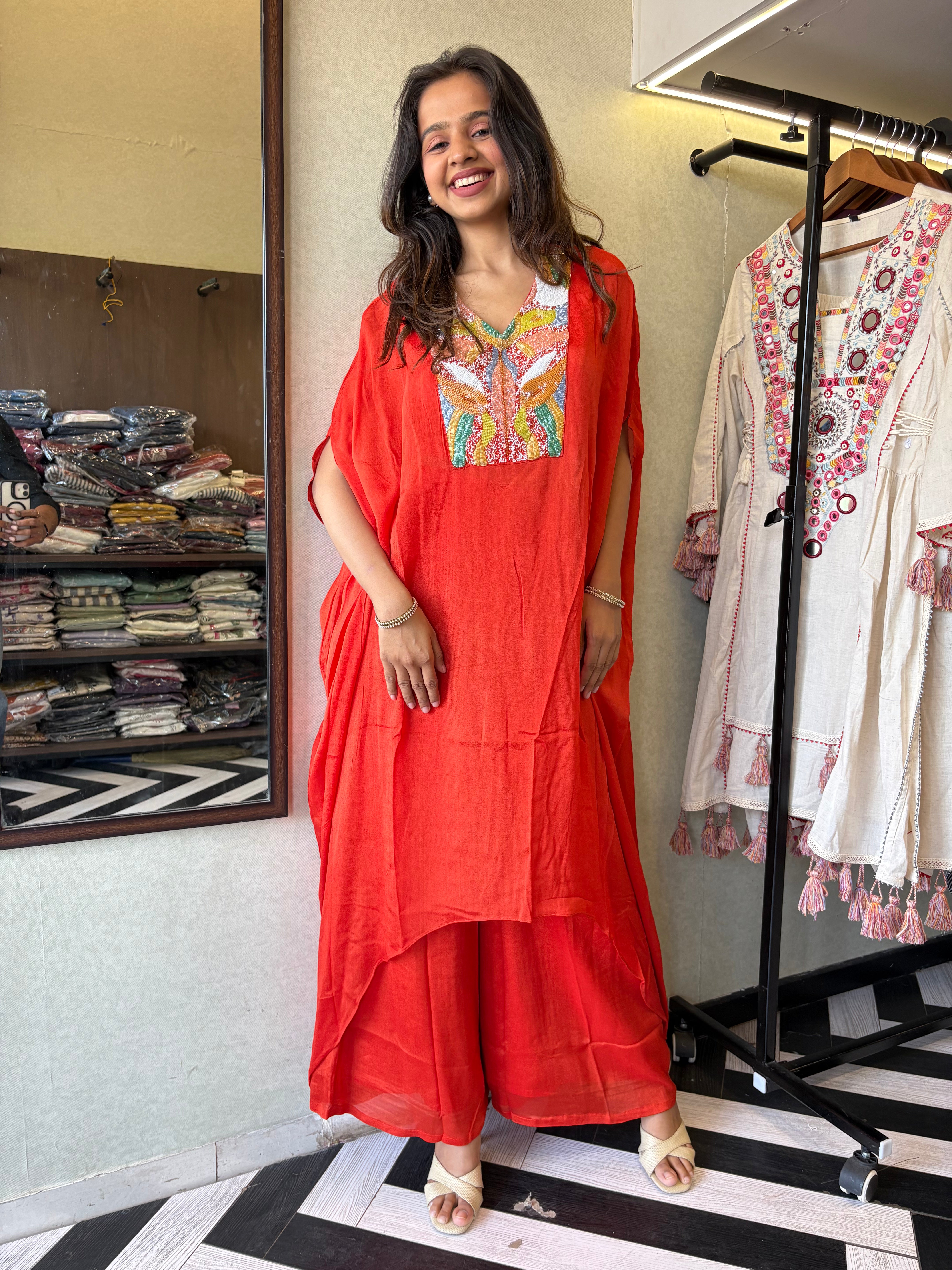 Image of Step into the spotlight in this premium 2-piece Indo-Western set in a breathtaking orange rust hue.