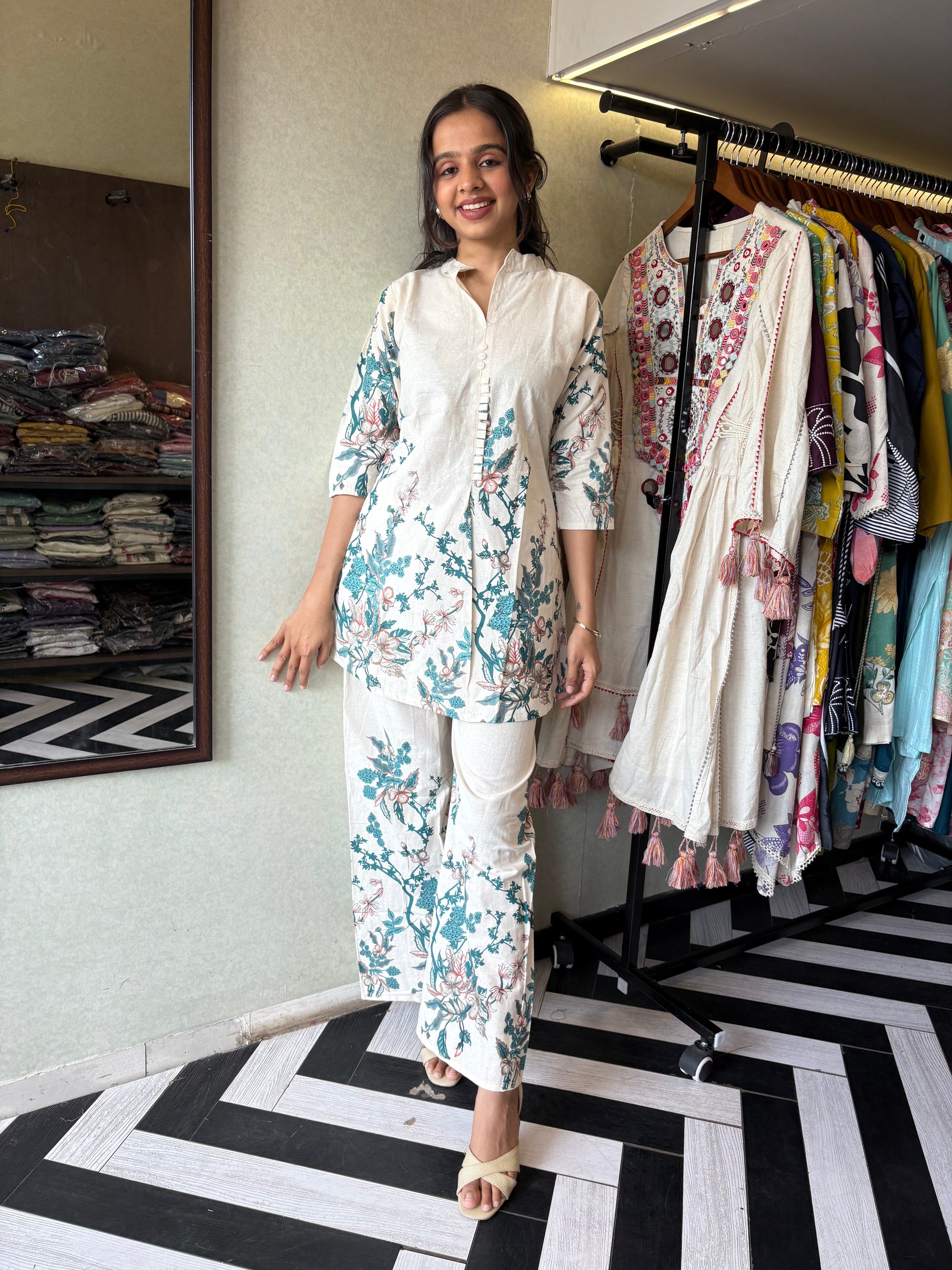 This pure cotton co-ord set in a designer white print is your summer savior - soft on the skin, bold on fashion