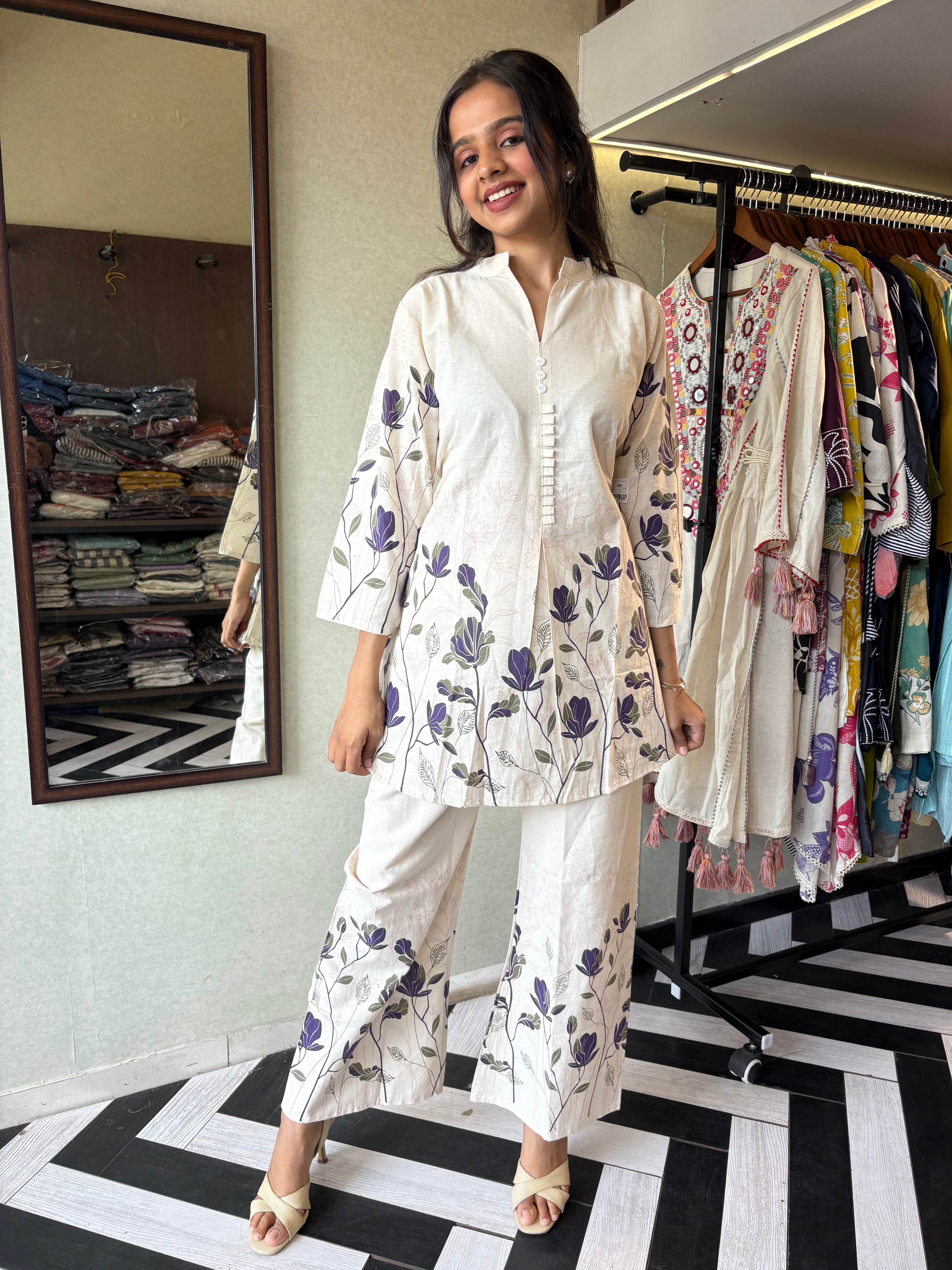 This pure cotton co-ord set in a designer white print is your summer savior - soft on the skin, bold on fashion