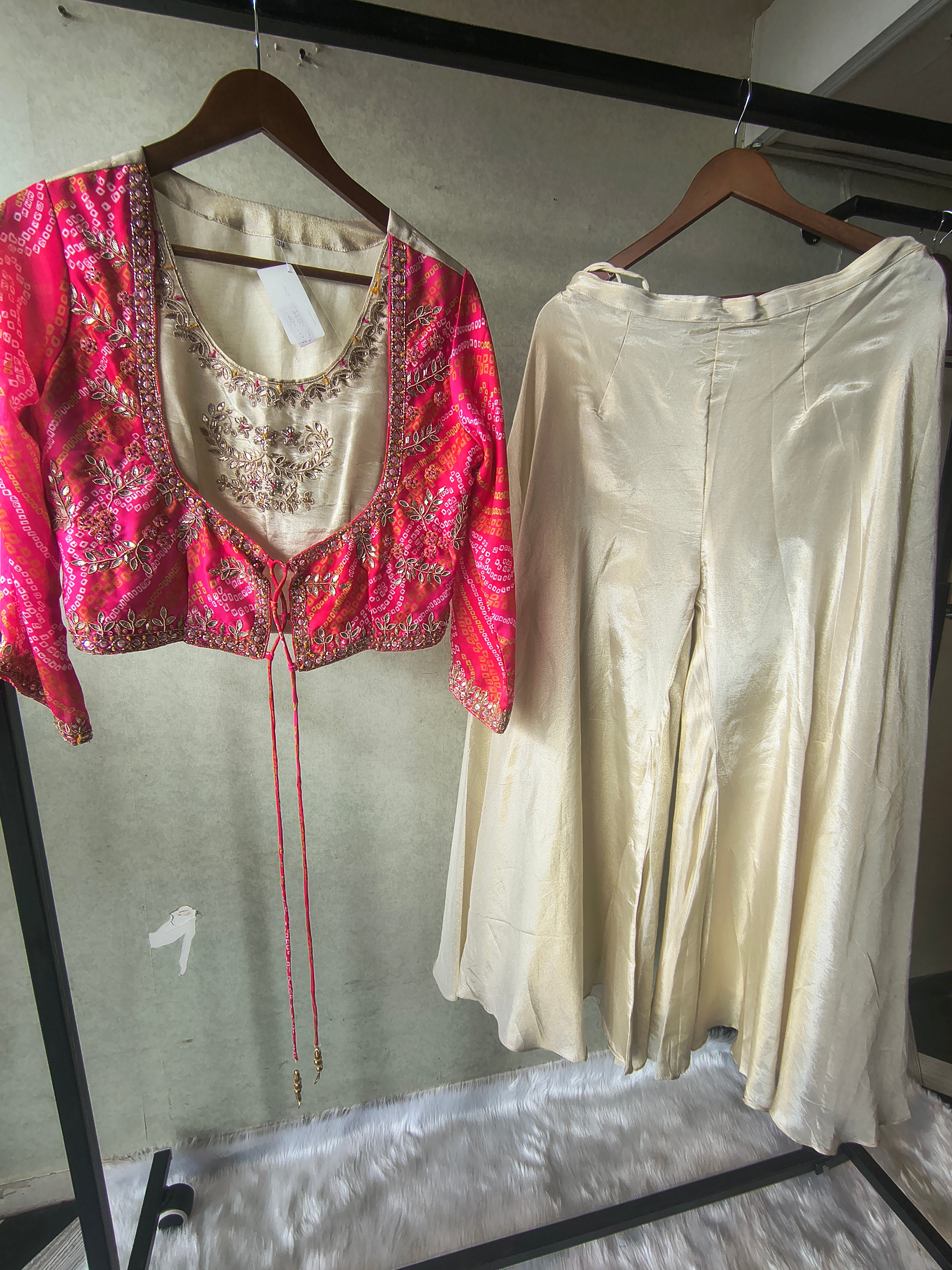 Image of Premium Hot Pink Bandhani Print Embroidered Jacket Blouse with Ivory Flared Palazzo Set