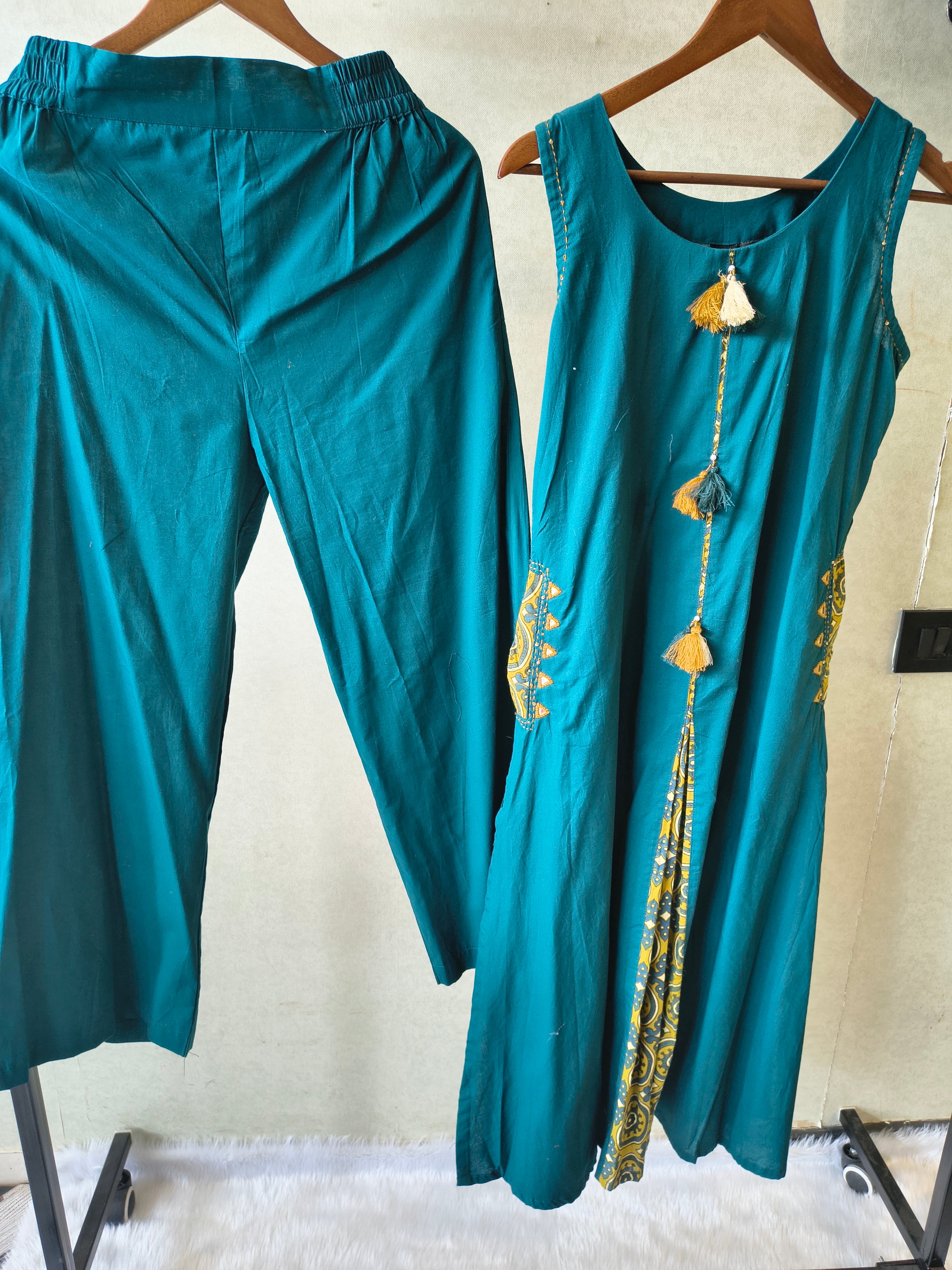 Image of Teal Sleeveless A-Line Kurta Set with Printed Panel & Straight Pants