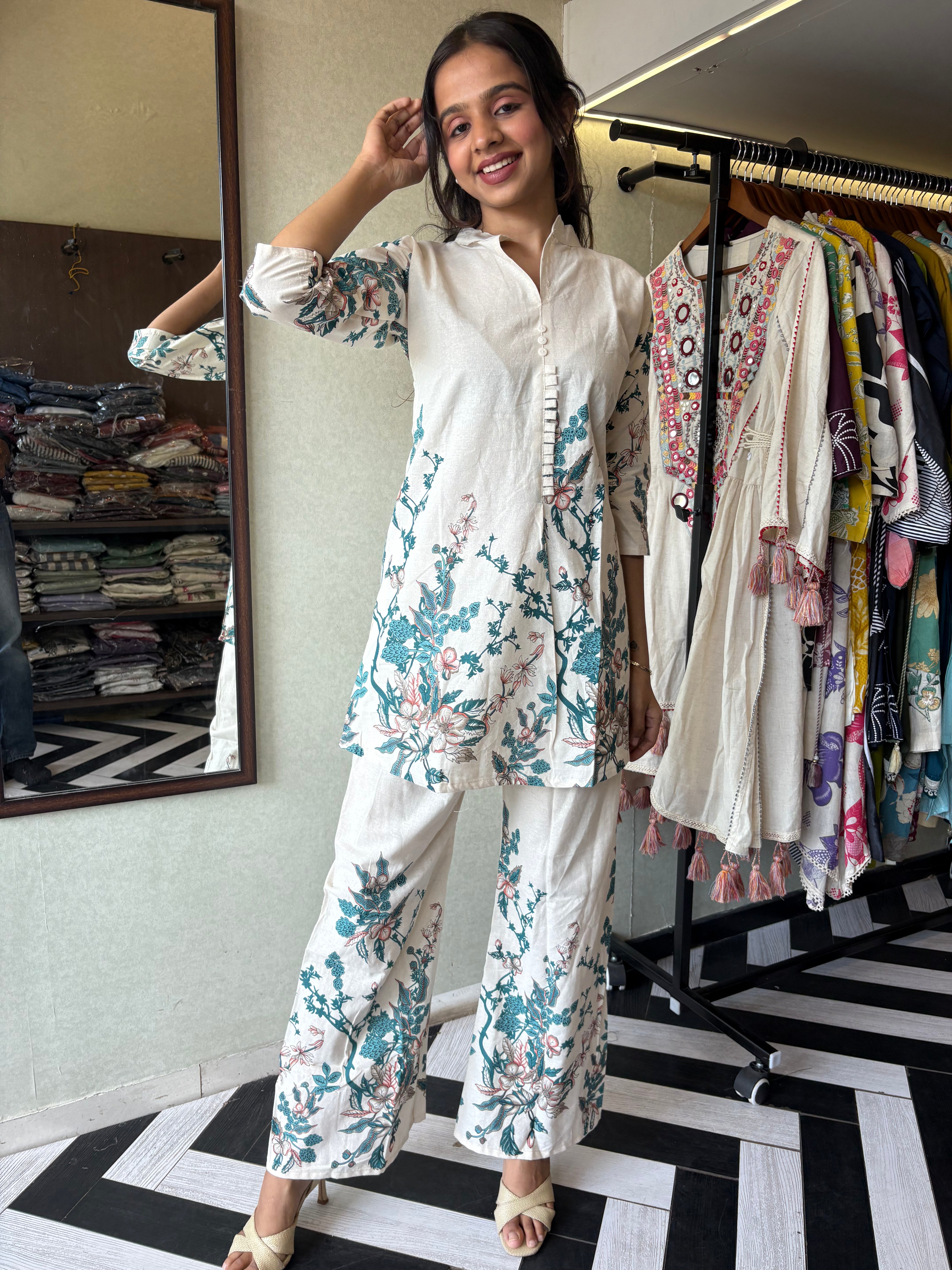 This pure cotton co-ord set in a designer white print is your summer savior - soft on the skin, bold on fashion
