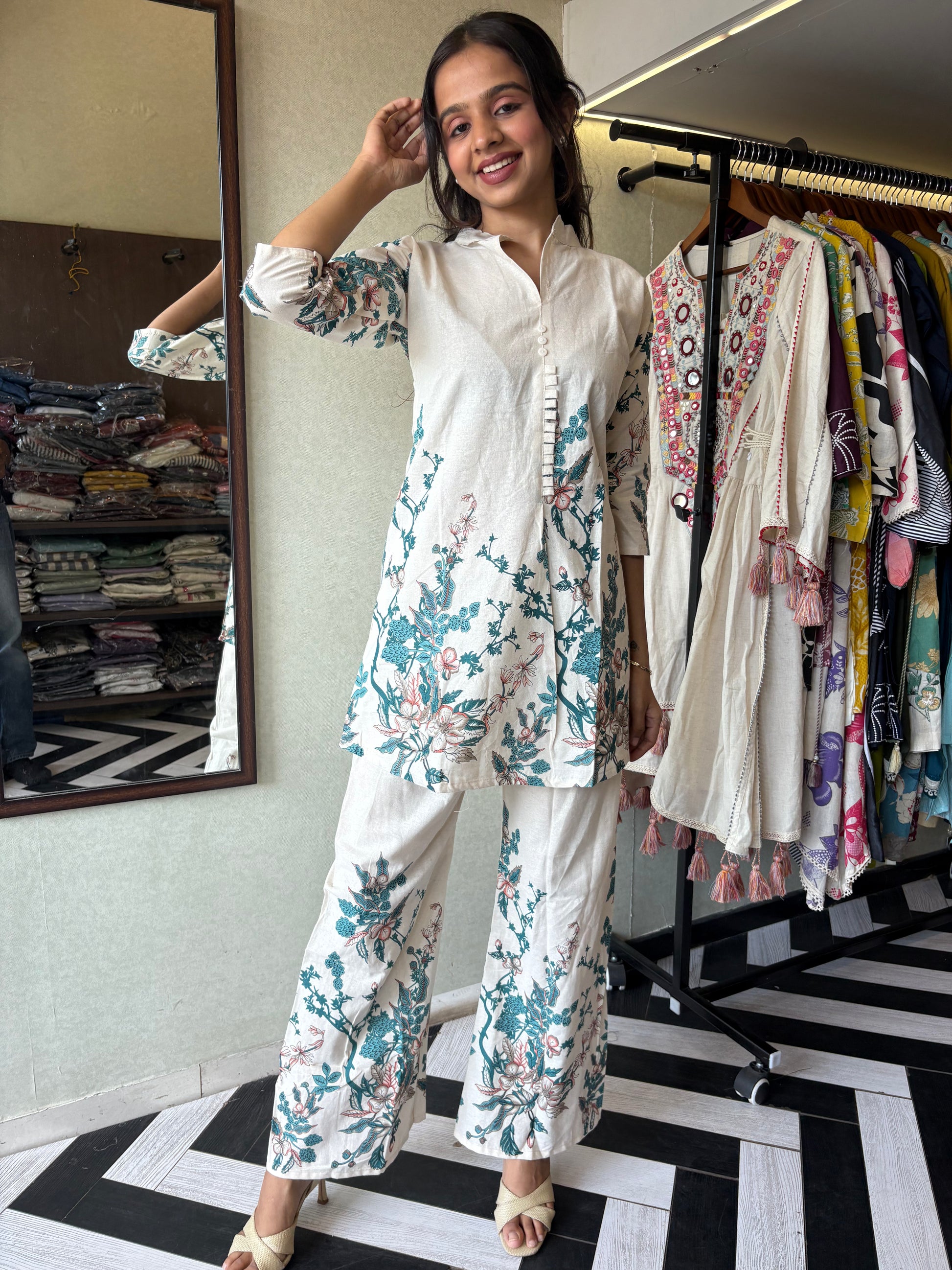 This pure cotton co-ord set in a designer white print is your summer savior - soft on the skin, bold on fashion