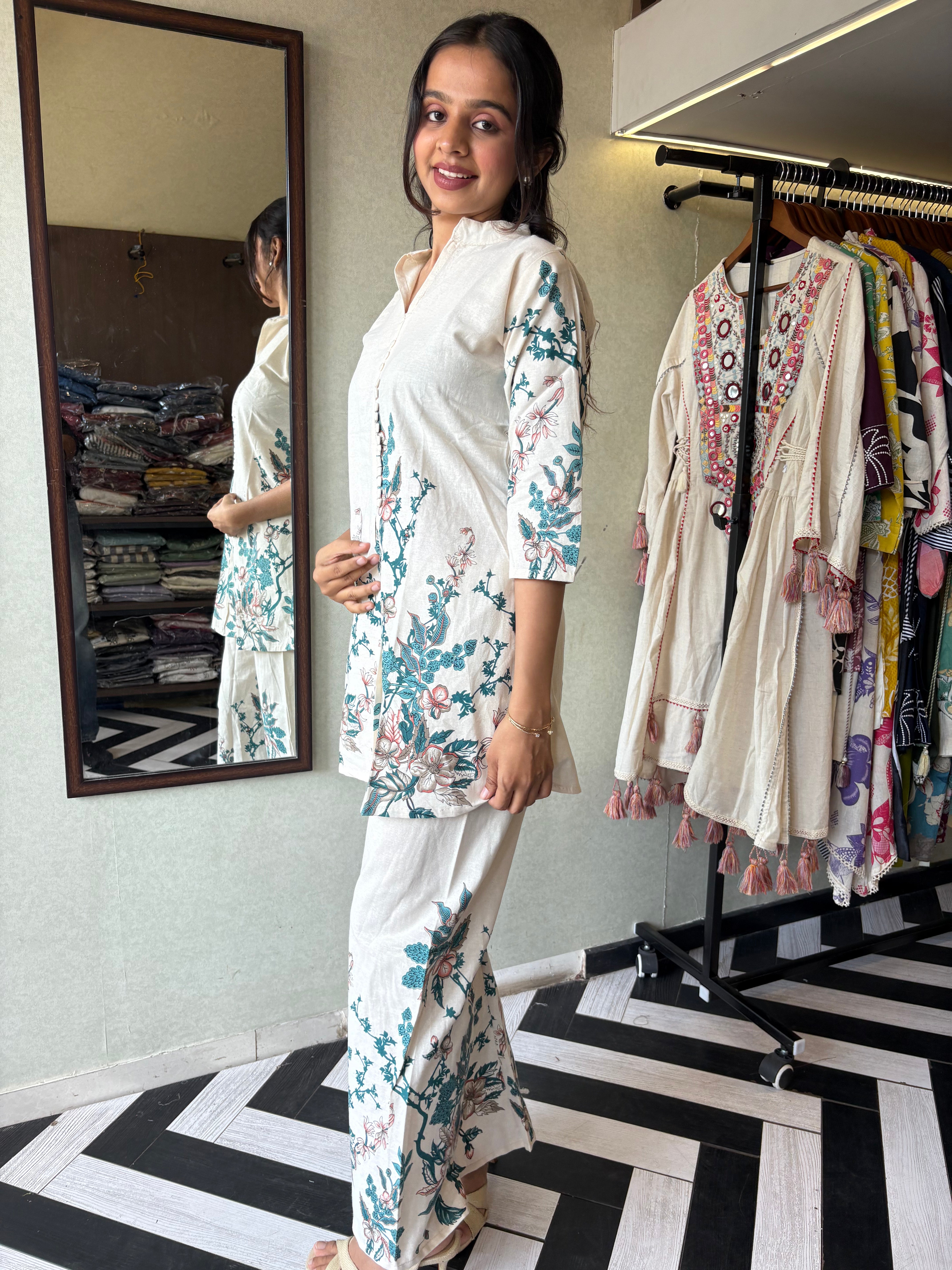 This pure cotton co-ord set in a designer white print is your summer savior - soft on the skin, bold on fashion