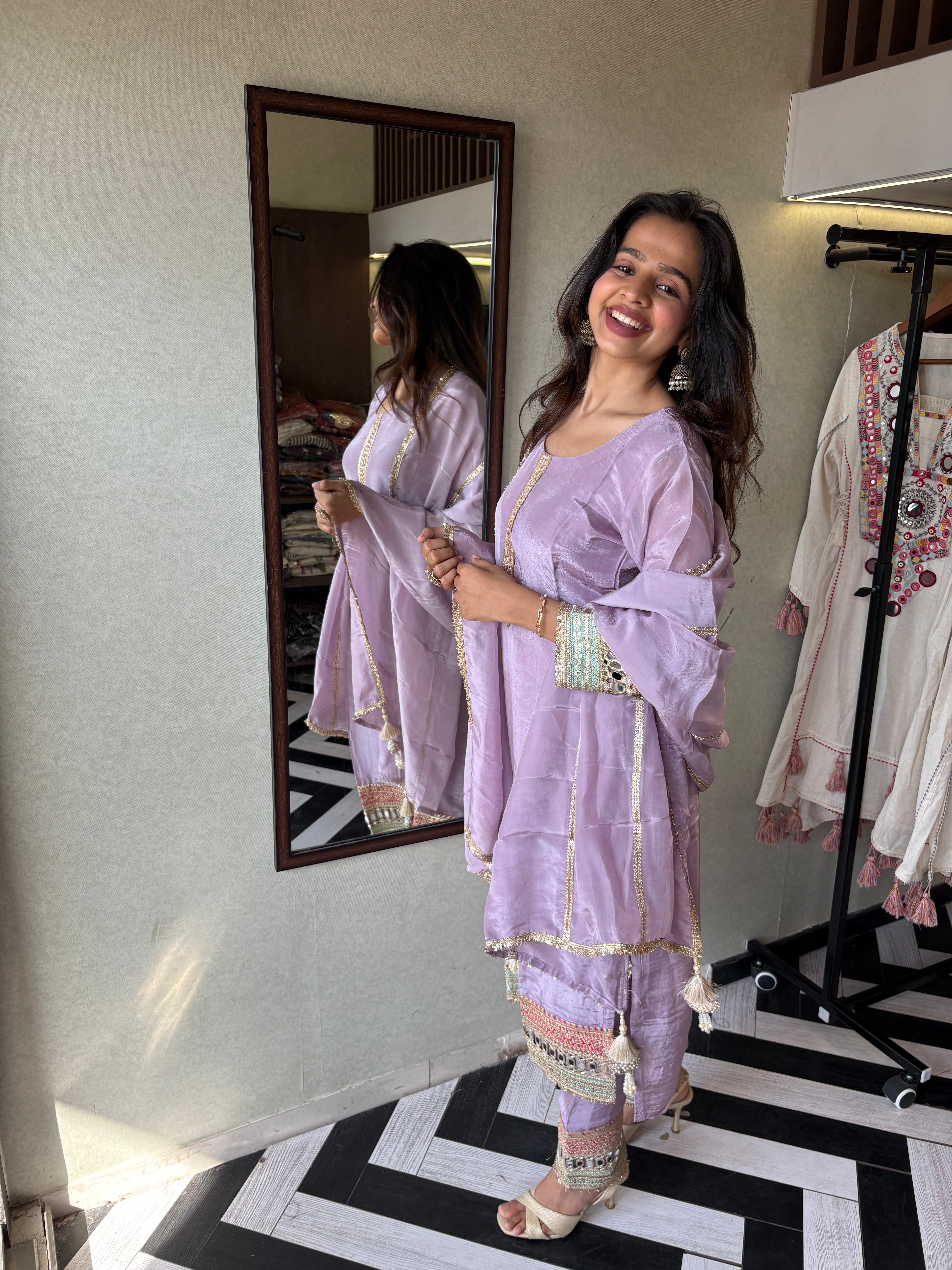 Image of Shine Bright in Royal Magenta!

Crafted in pure silk crepe, this designer straight-cut kurti set is finished with mirror handwork on sleeves and pant ends - a perfect blend of subtle glam and timeless class.