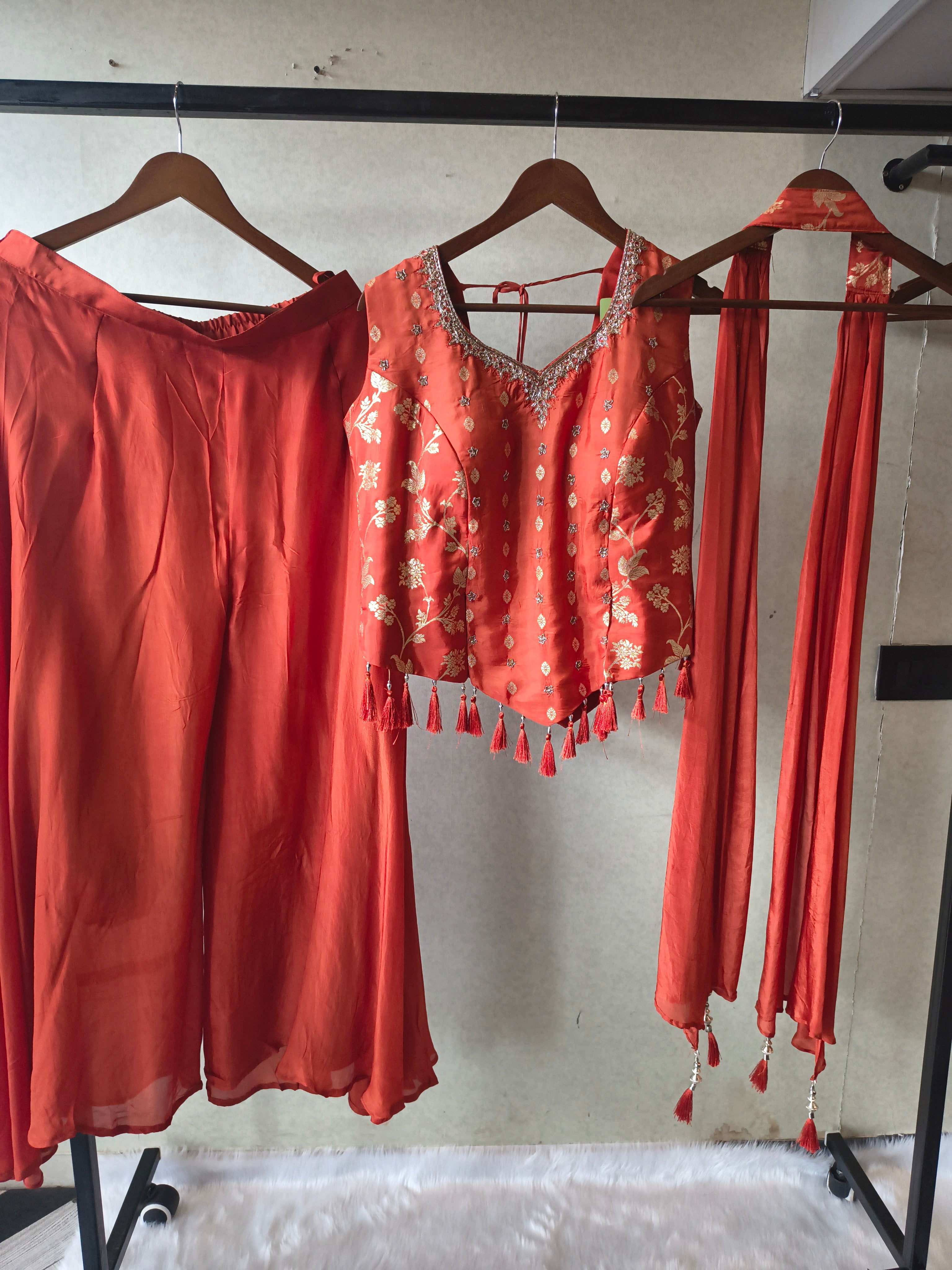 Image of Premium Rust Orange 3-Piece Designer Lehenga Set with Zari Embroidered Peplum Blouse & Tassel Dupatta