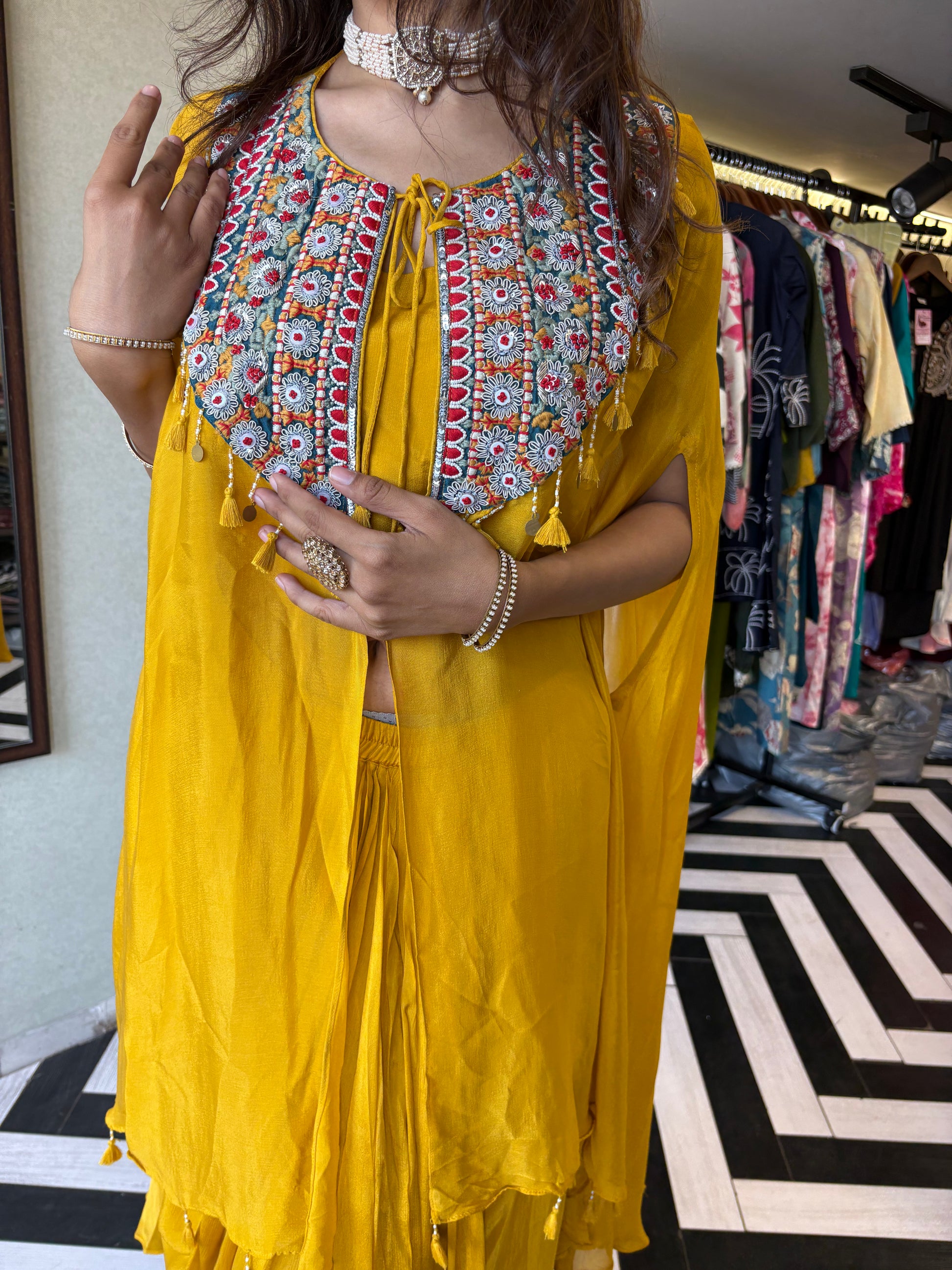 Step into the spotlight with our stunning yellow pure georgette Indo-Western 2-piece. Designed with intricate handwork and full sequin craftsmanship, this piece delivers pure elegance for those who love to shine bright
