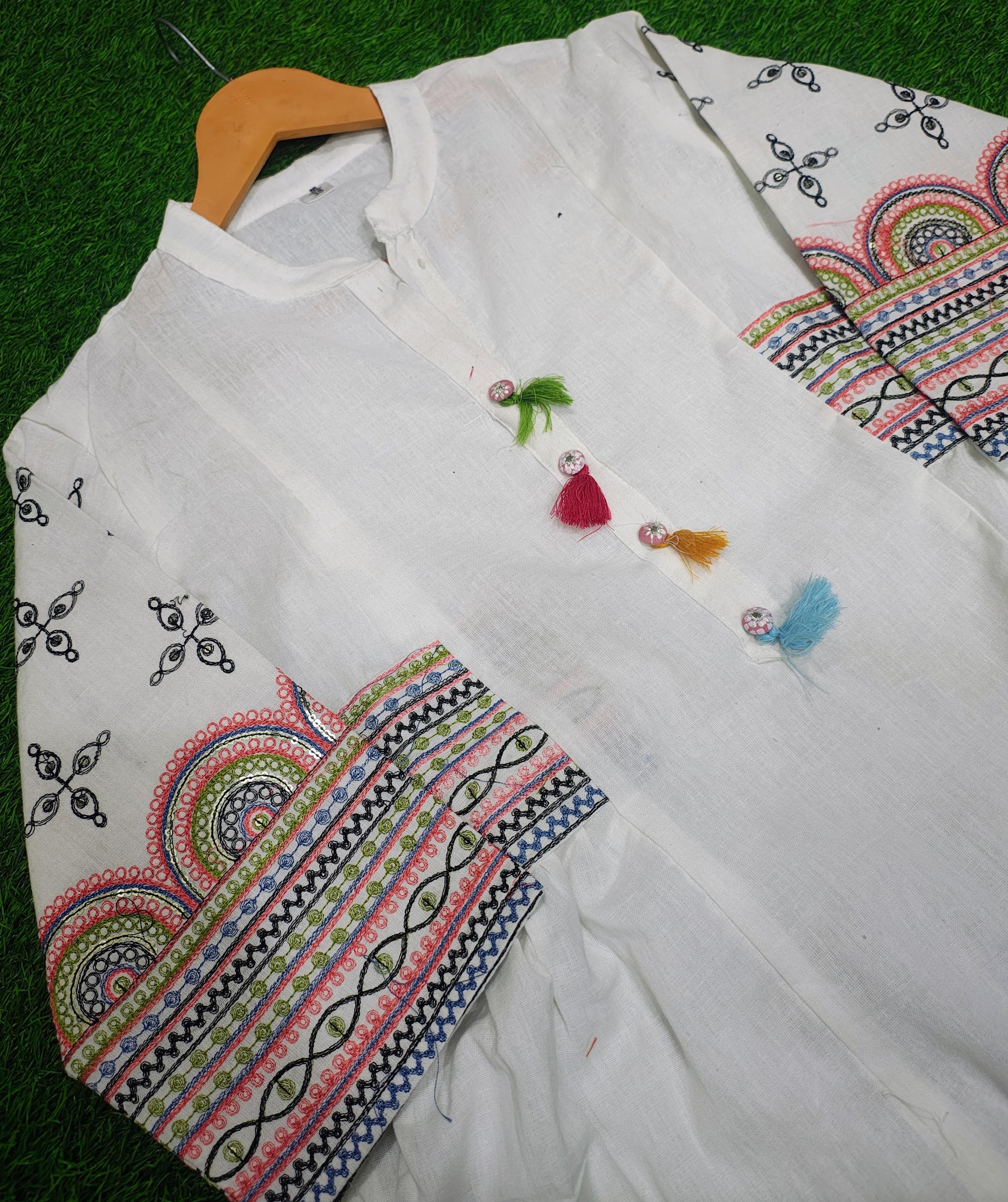 Image of Aline kurta Style made from high-quality cotton flex, embellished with sequance embroidery work on hand sleeves and side line and paired with matching pant.