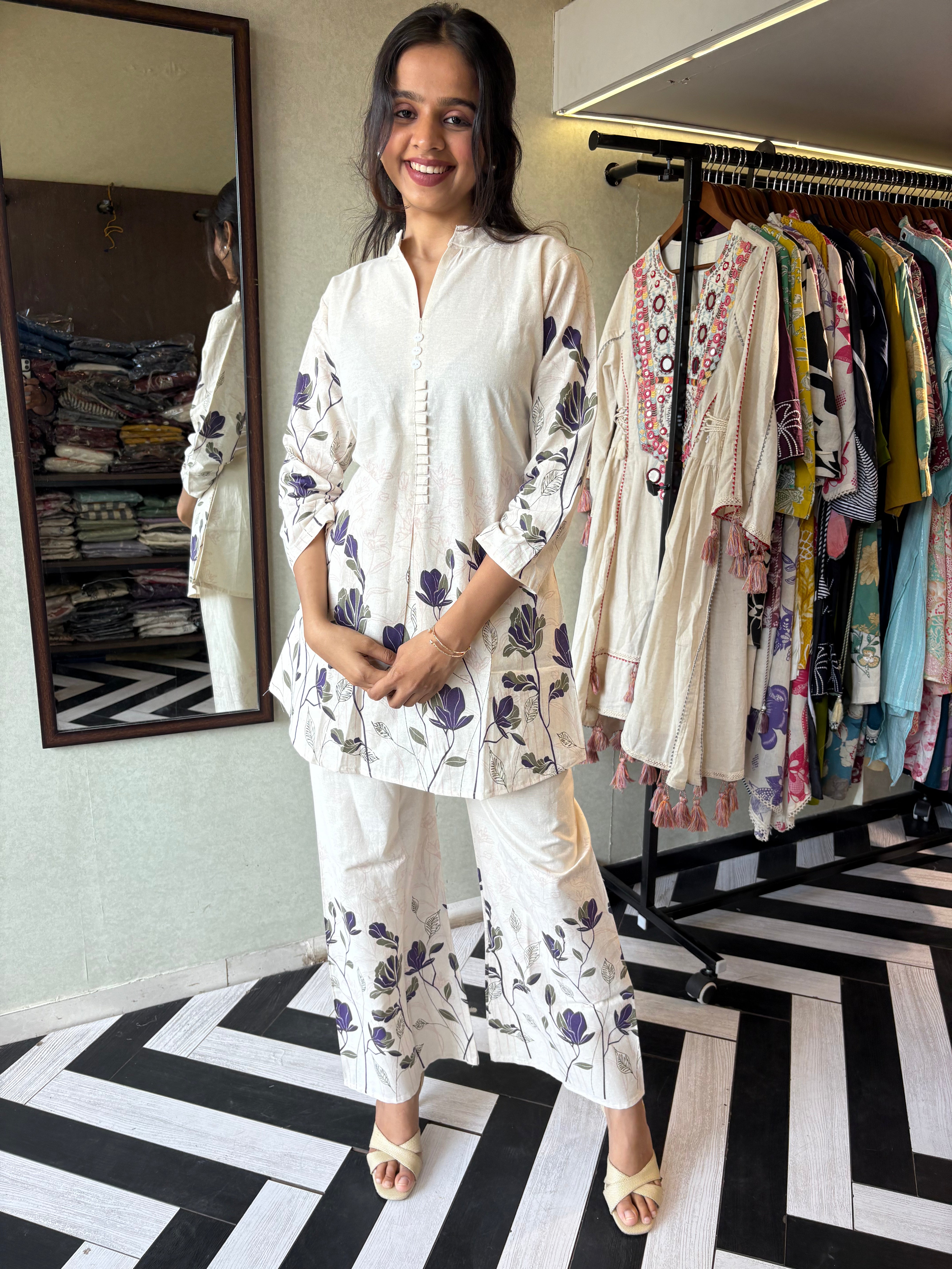 This pure cotton co-ord set in a designer white print is your summer savior - soft on the skin, bold on fashion