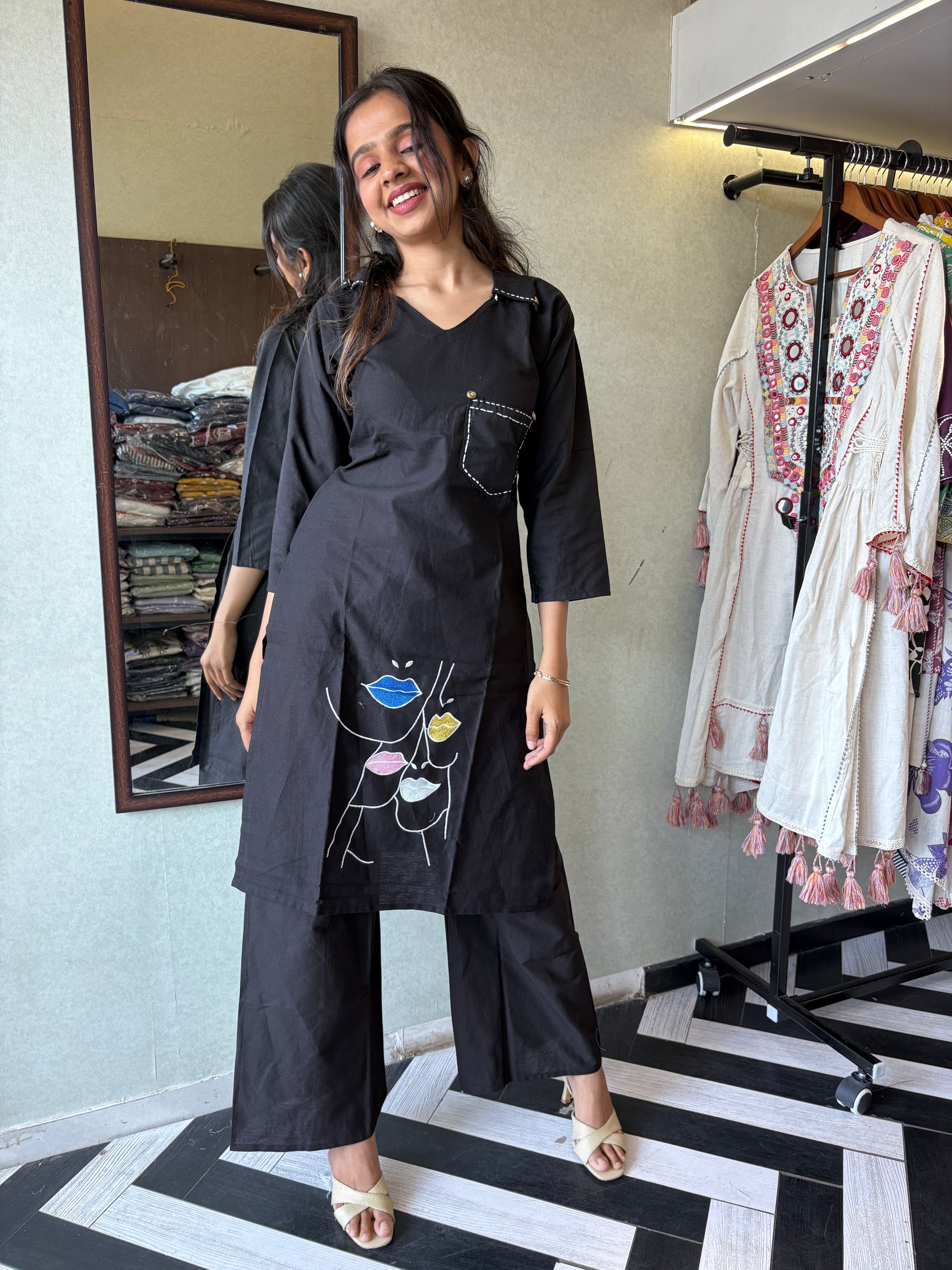 pure cotton black co-ord set, elevated with elegant embroidery detailing. It's a wardrobe must-have that looks premium