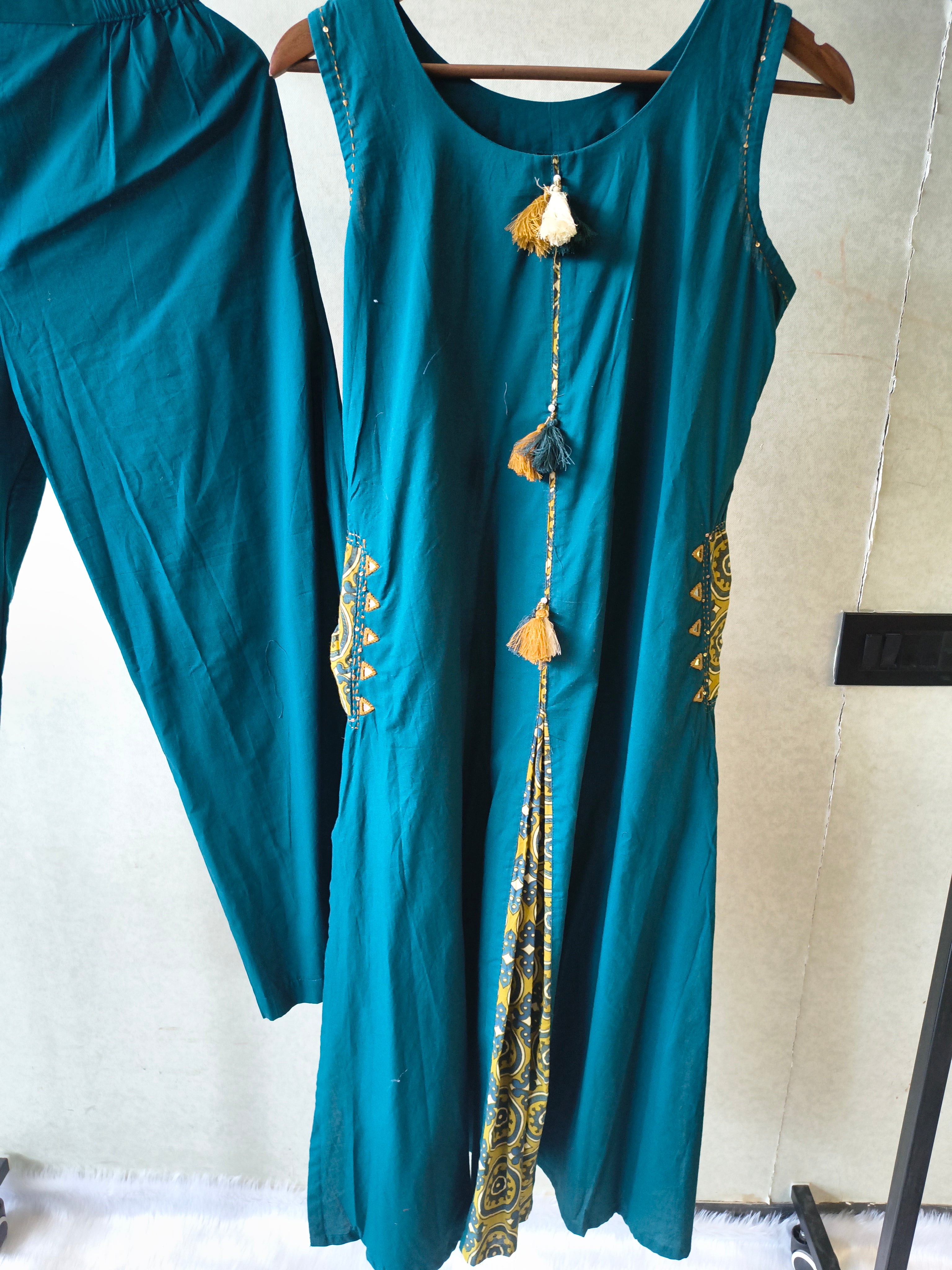 Image of Teal Sleeveless A-Line Kurta Set with Printed Panel & Straight Pants