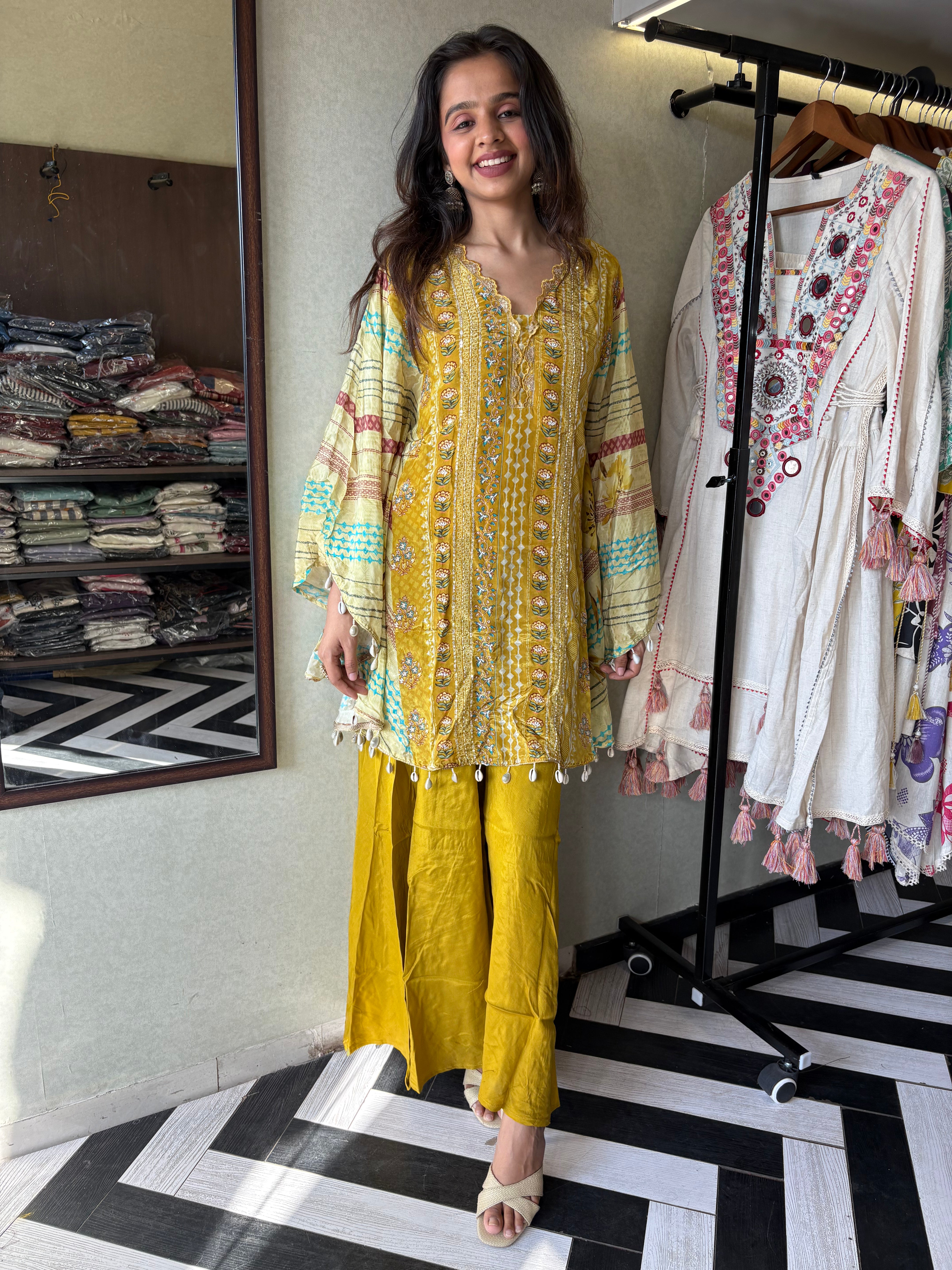 Crafted from pure crepe fabric with hand-sequenced accessory work - it's the sunshine outfit your wardrobe needs!