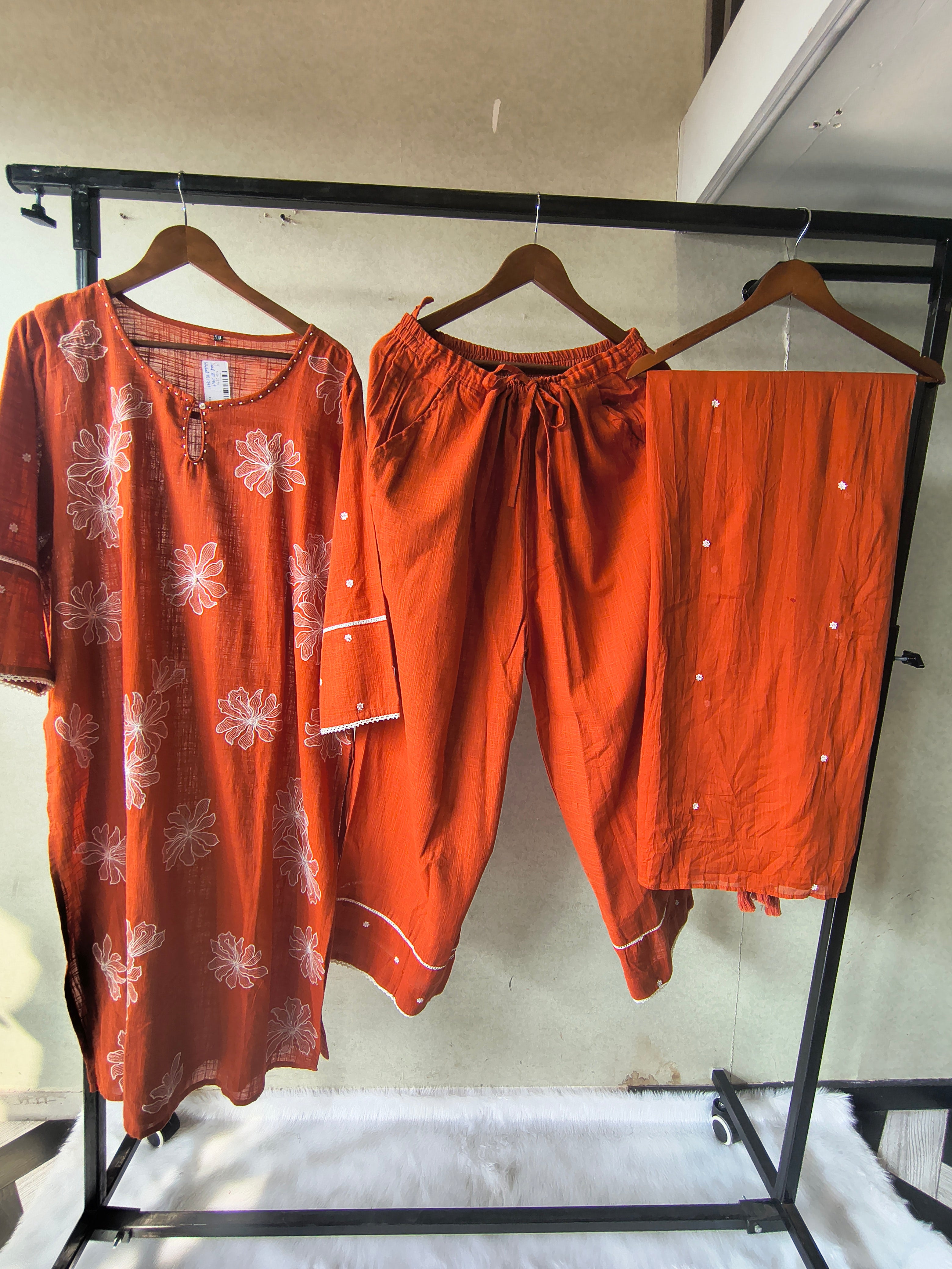 Image of Rust Orange Floral Printed Cotton Kurta Set with Solid Pants & Embroidered Dupatta