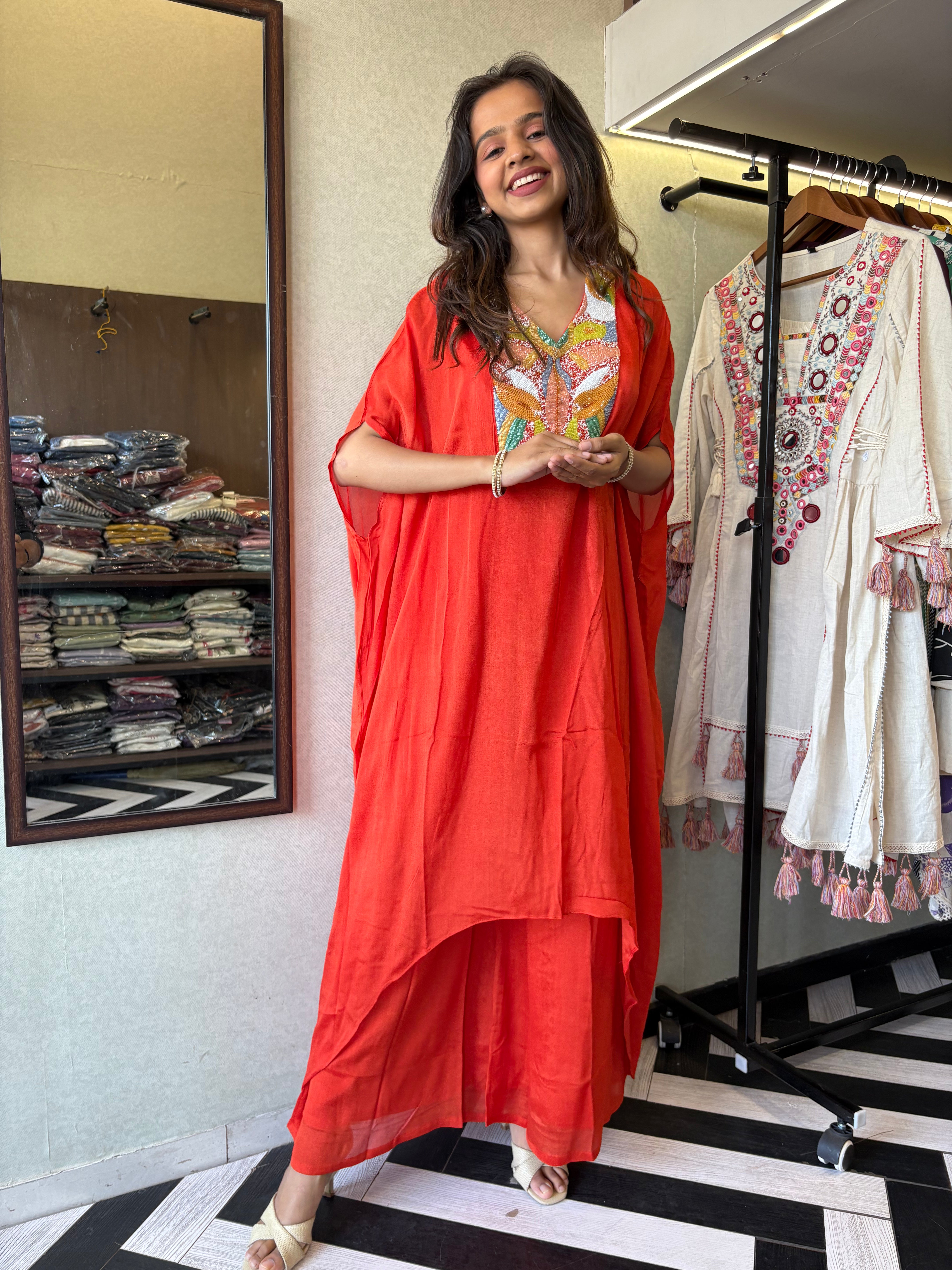 Image of Step into the spotlight in this premium 2-piece Indo-Western set in a breathtaking orange rust hue.