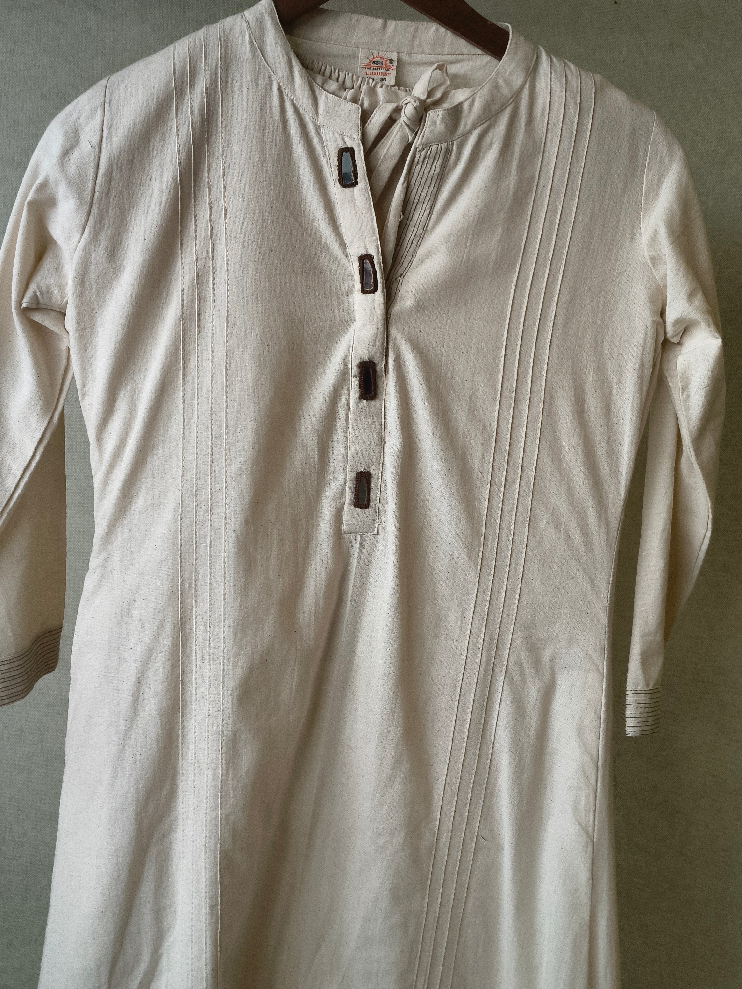 Image of Premium Off-White Cotton A-Line Kurta & Pant Co-Ord Set with Pintuck Detailing