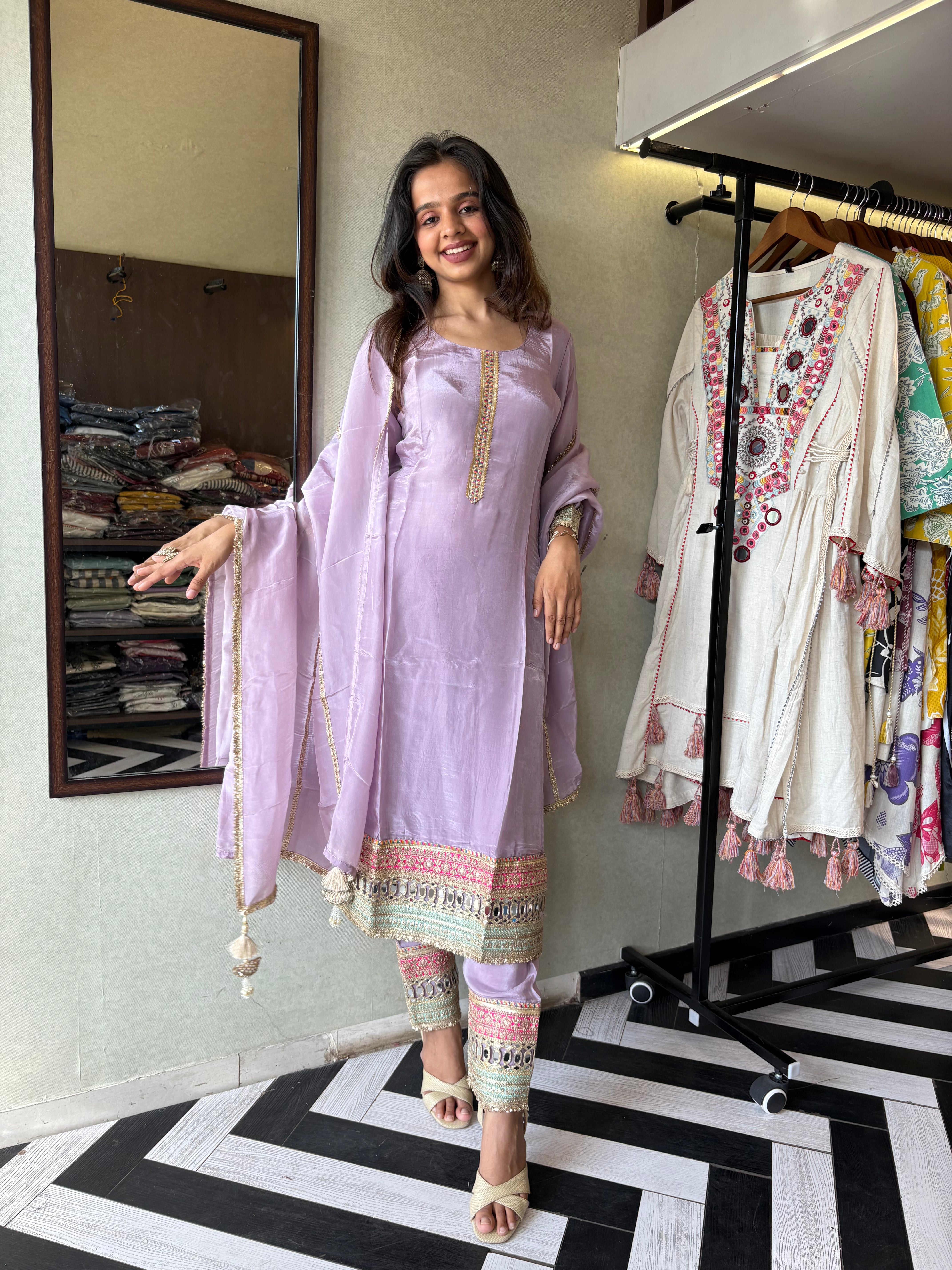 Shine Bright in Royal Magenta!

Crafted in pure silk crepe, this designer straight-cut kurti set is finished with mirror handwork on sleeves and pant ends - a perfect blend of subtle glam and timeless class.