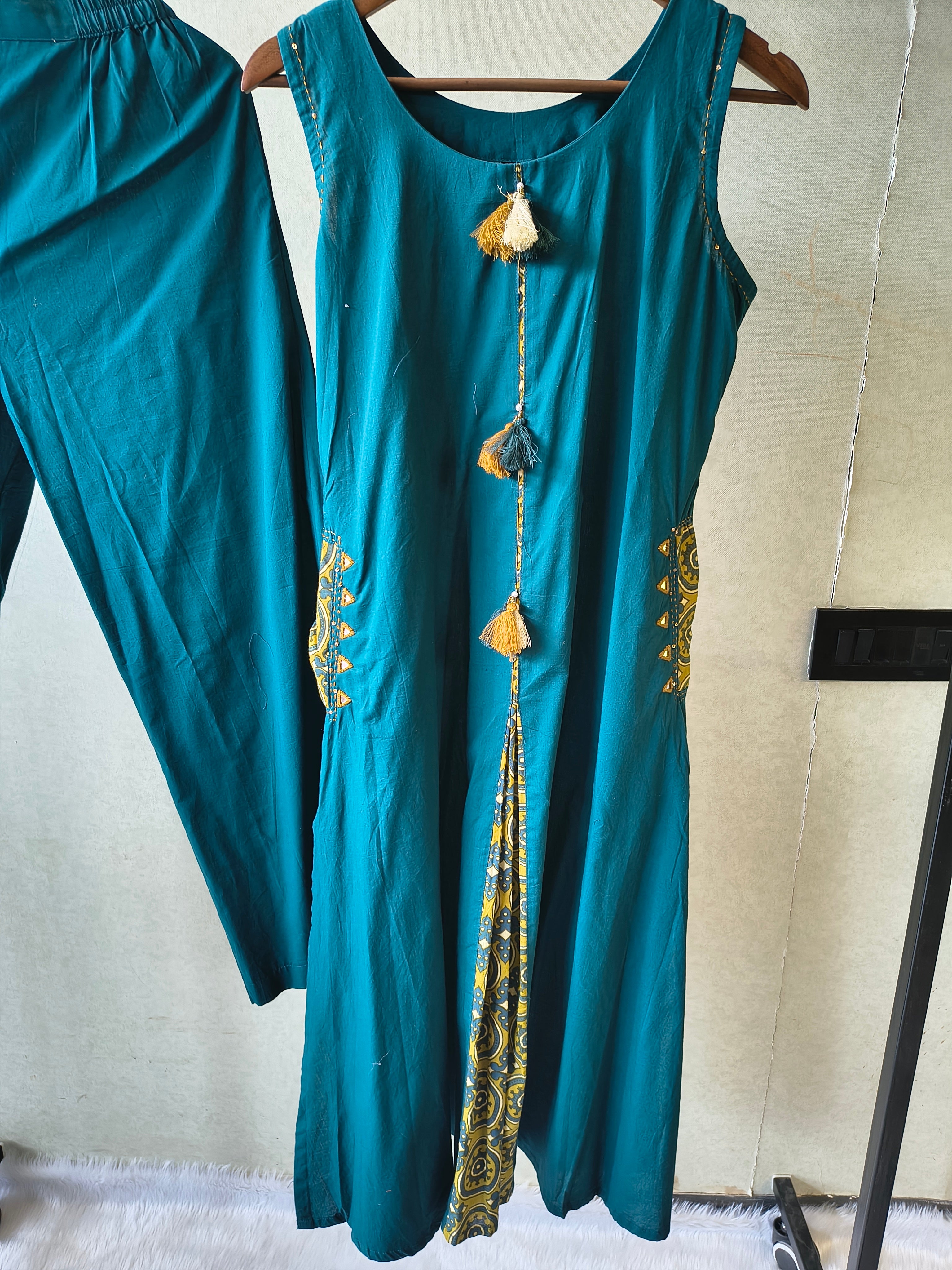 Image of Teal Sleeveless A-Line Kurta Set with Printed Panel & Straight Pants