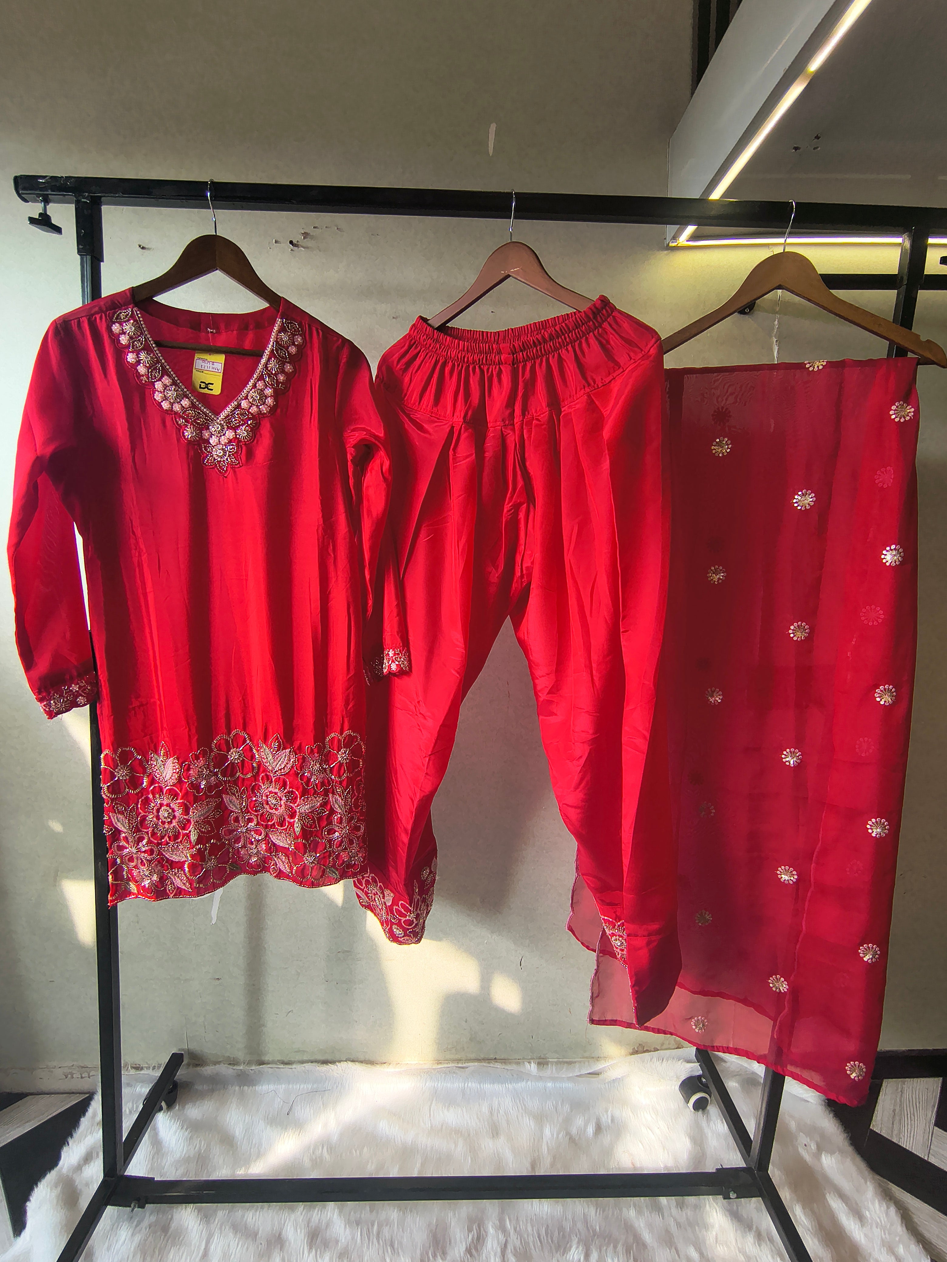 Image of Ruby Red Embroidered Straight Kurta Set with Floral Thread Work, Designer Neckline & Embellished Dupatta – Premium 3 Piece Ethnic Ensemble