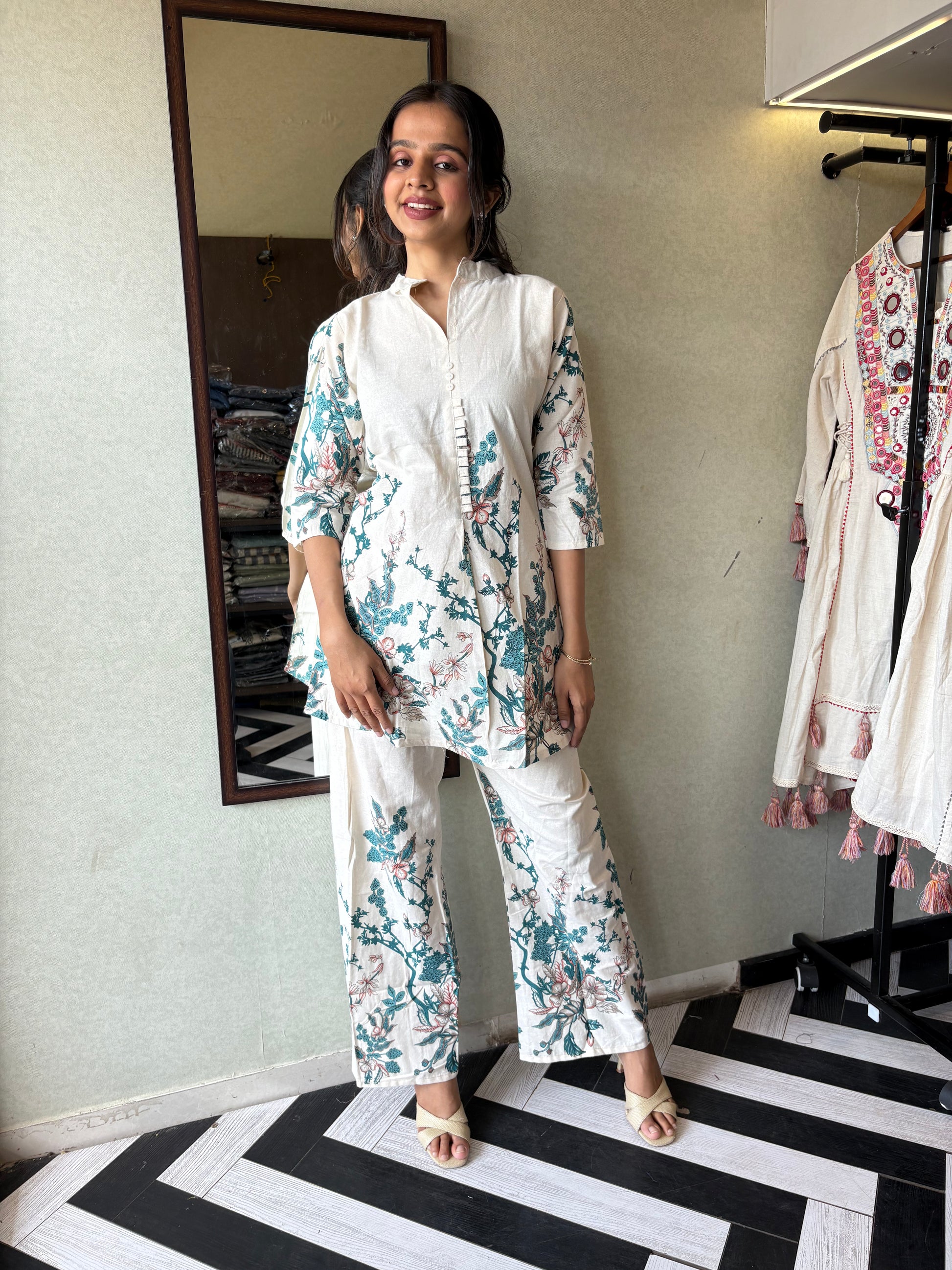 This pure cotton co-ord set in a designer white print is your summer savior - soft on the skin, bold on fashion