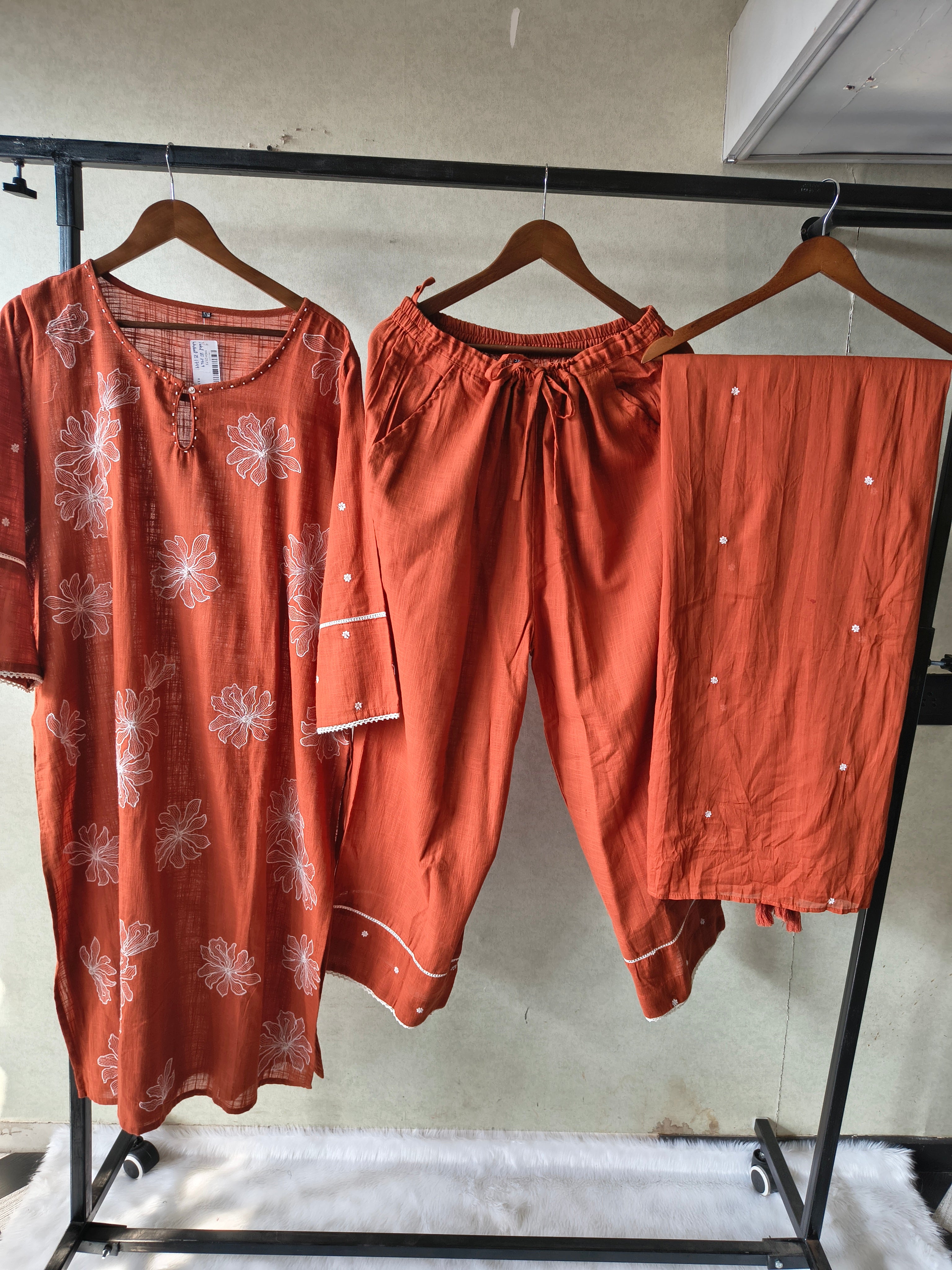 Image of Rust Orange Floral Printed Cotton Kurta Set with Solid Pants & Embroidered Dupatta