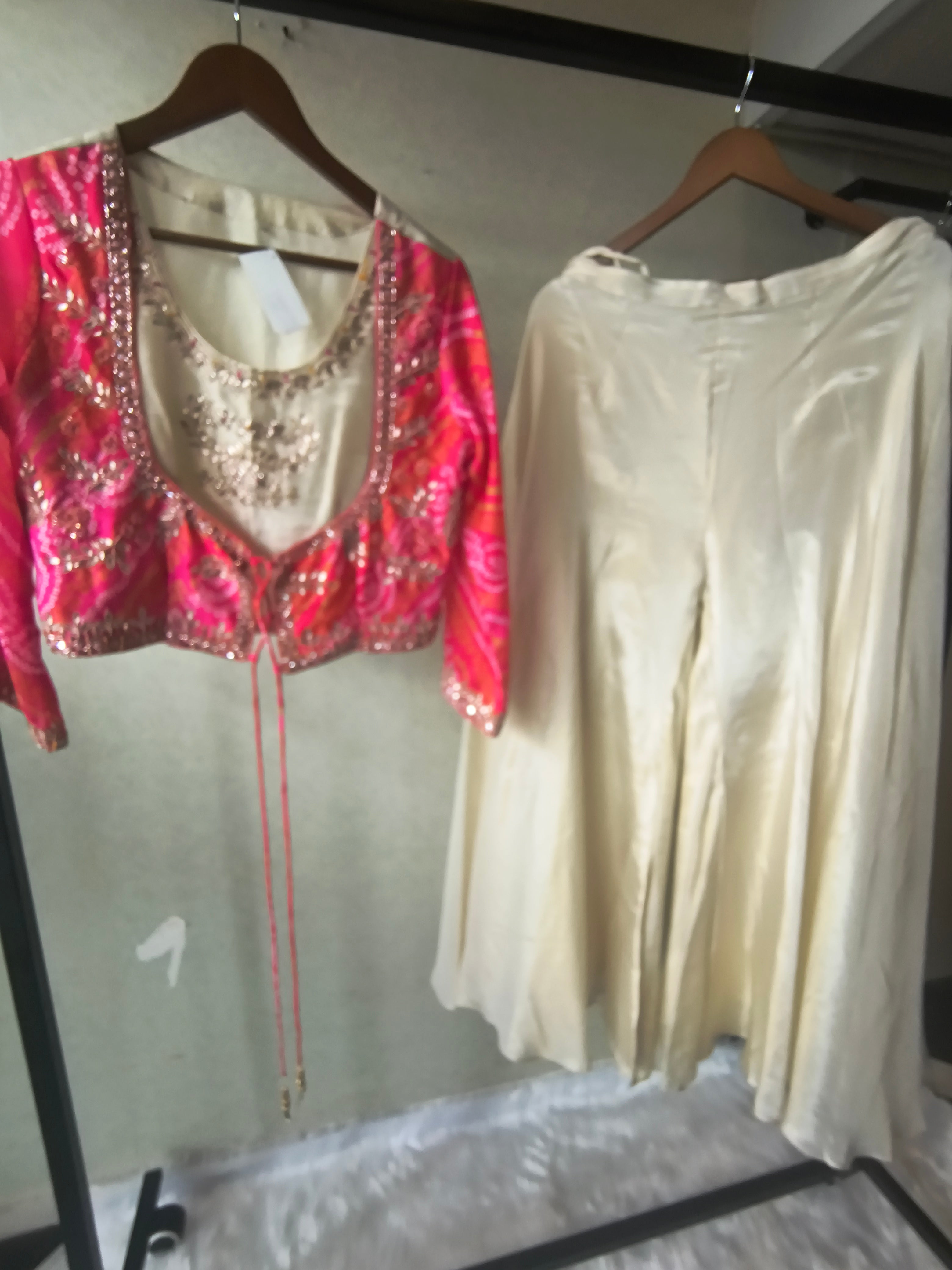 Image of Premium Hot Pink Bandhani Print Embroidered Jacket Blouse with Ivory Flared Palazzo Set