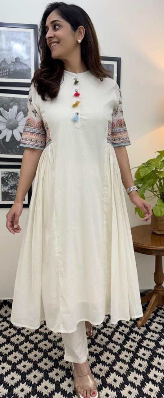 Image of Aline kurta Style made from high-quality cotton flex, embellished with sequance embroidery work on hand sleeves and side line and paired with matching pant.