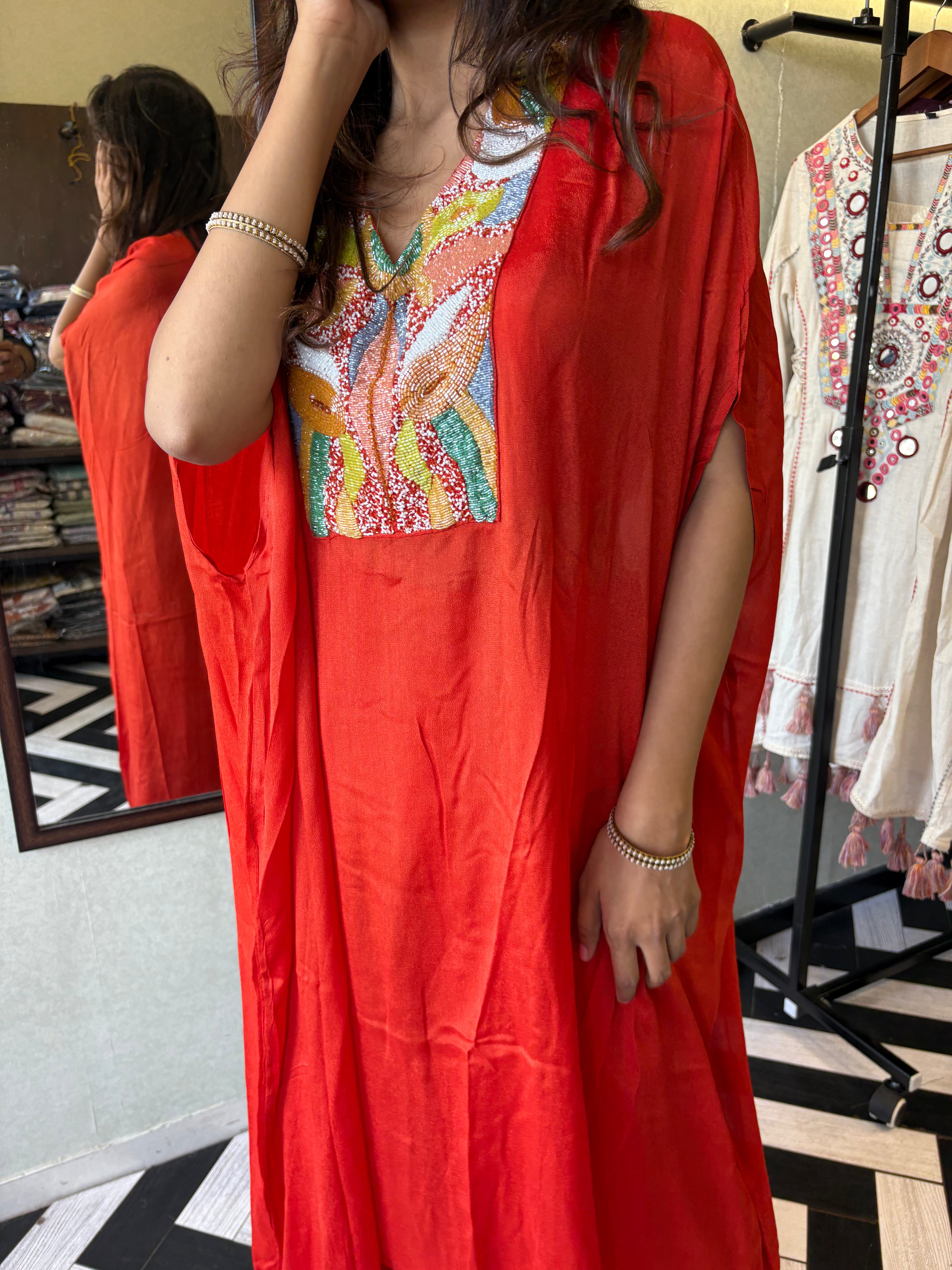 Image of Step into the spotlight in this premium 2-piece Indo-Western set in a breathtaking orange rust hue.