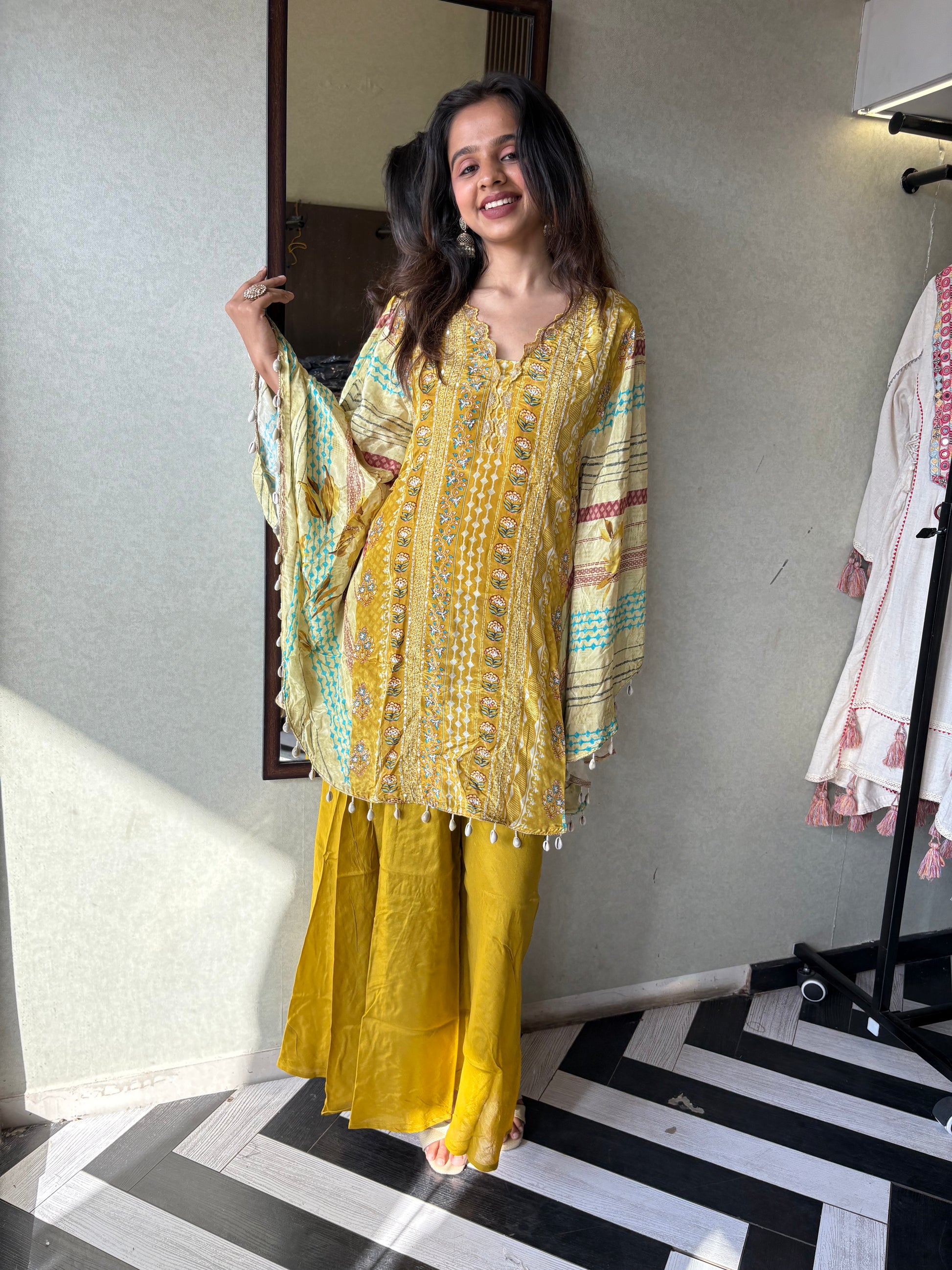 Crafted from pure crepe fabric with hand-sequenced accessory work - it's the sunshine outfit your wardrobe needs!