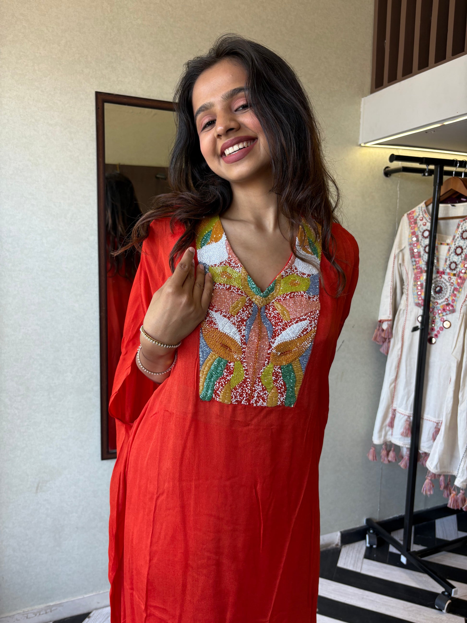 Step into the spotlight in this premium 2-piece Indo-Western set in a breathtaking orange rust hue.