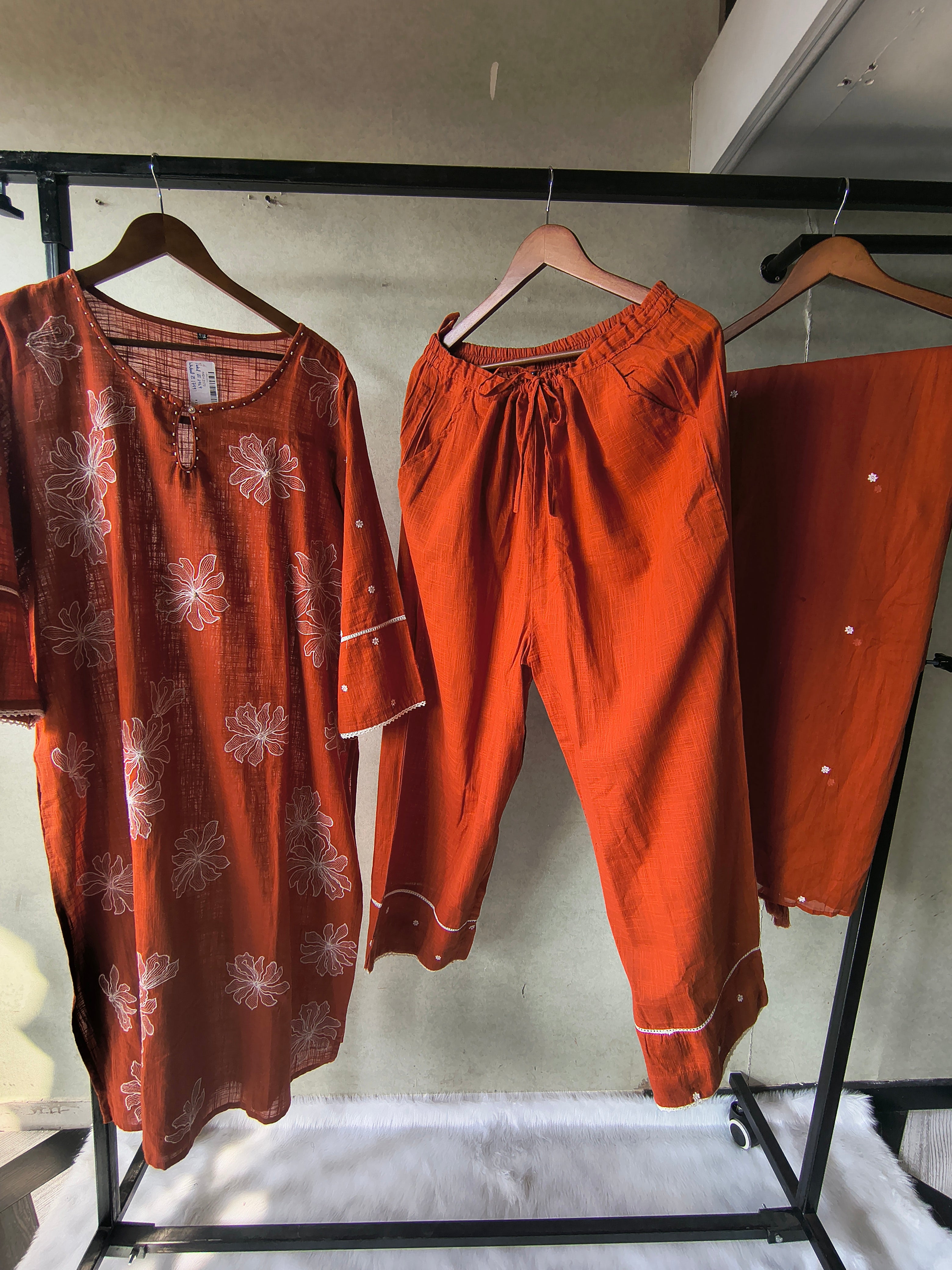Image of Rust Orange Floral Printed Cotton Kurta Set with Solid Pants & Embroidered Dupatta