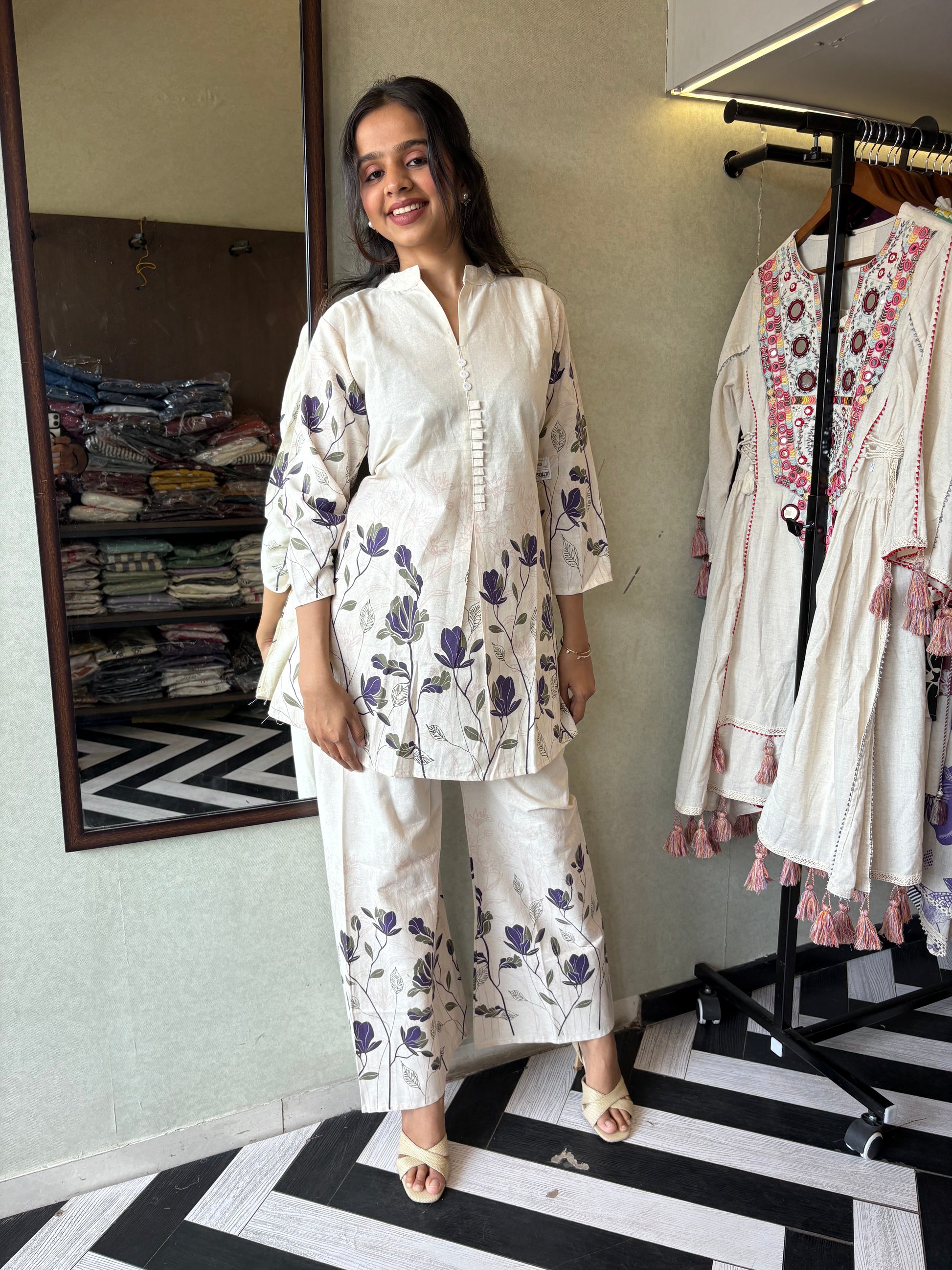 This pure cotton co-ord set in a designer white print is your summer savior - soft on the skin, bold on fashion