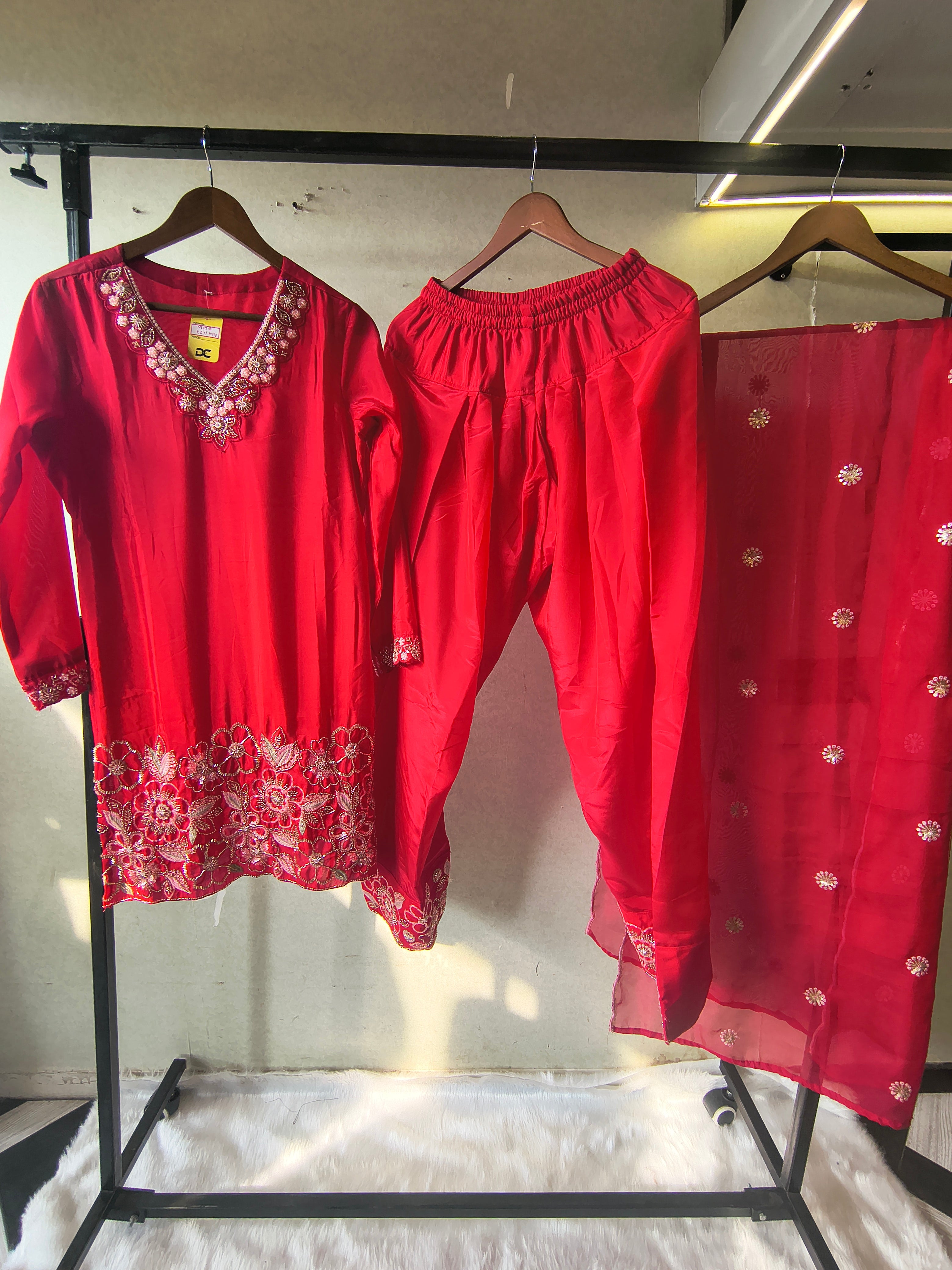 Image of Ruby Red Embroidered Straight Kurta Set with Floral Thread Work, Designer Neckline & Embellished Dupatta – Premium 3 Piece Ethnic Ensemble