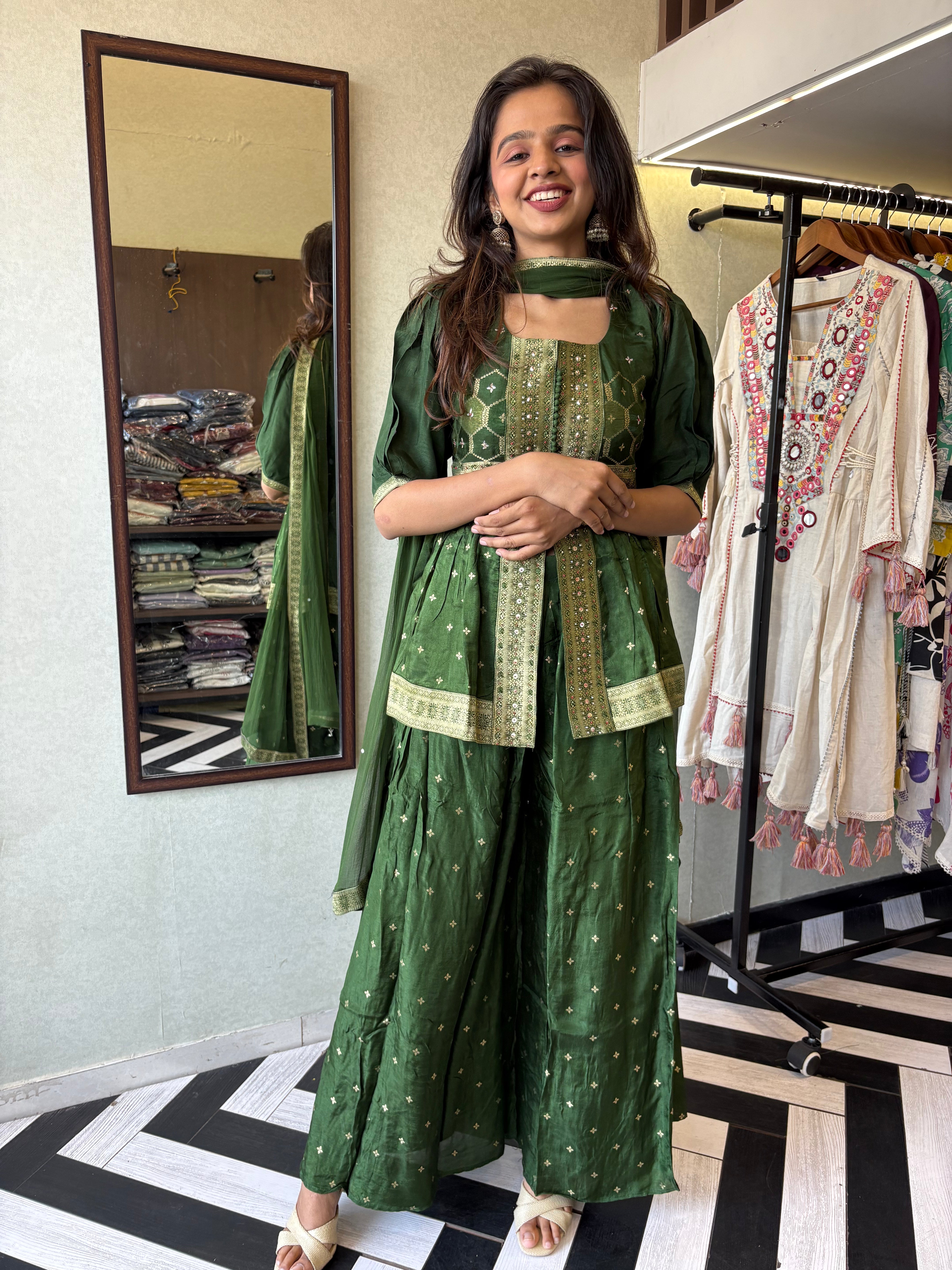 our premium pure silk 3-piece Indo-Western set in stunning green! From dazzling mirror & handwork on the jacket-style top to the flowing plazzo and dupatta