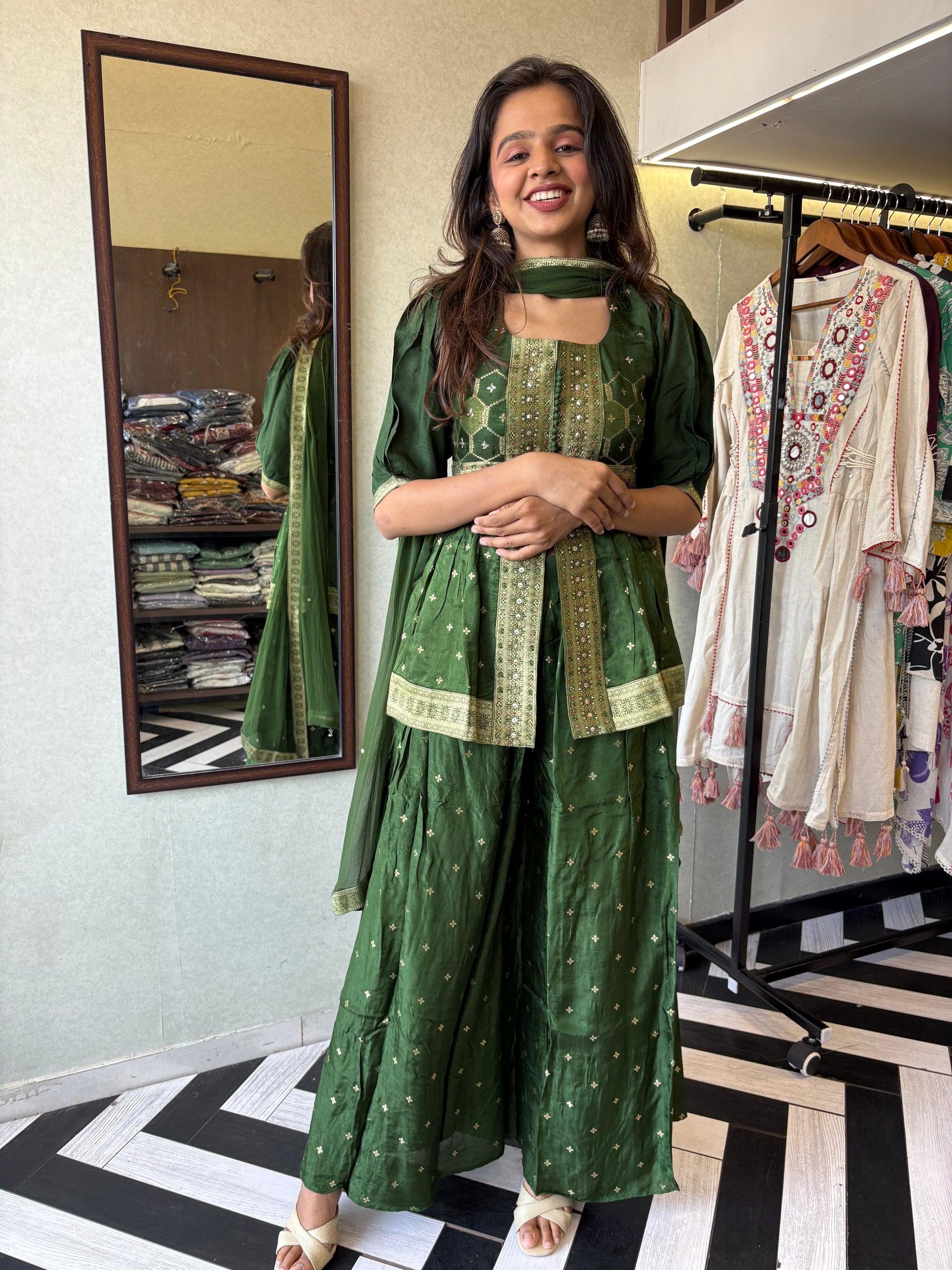 our premium pure silk 3-piece Indo-Western set in stunning green! From dazzling mirror & handwork on the jacket-style top to the flowing plazzo and dupatta