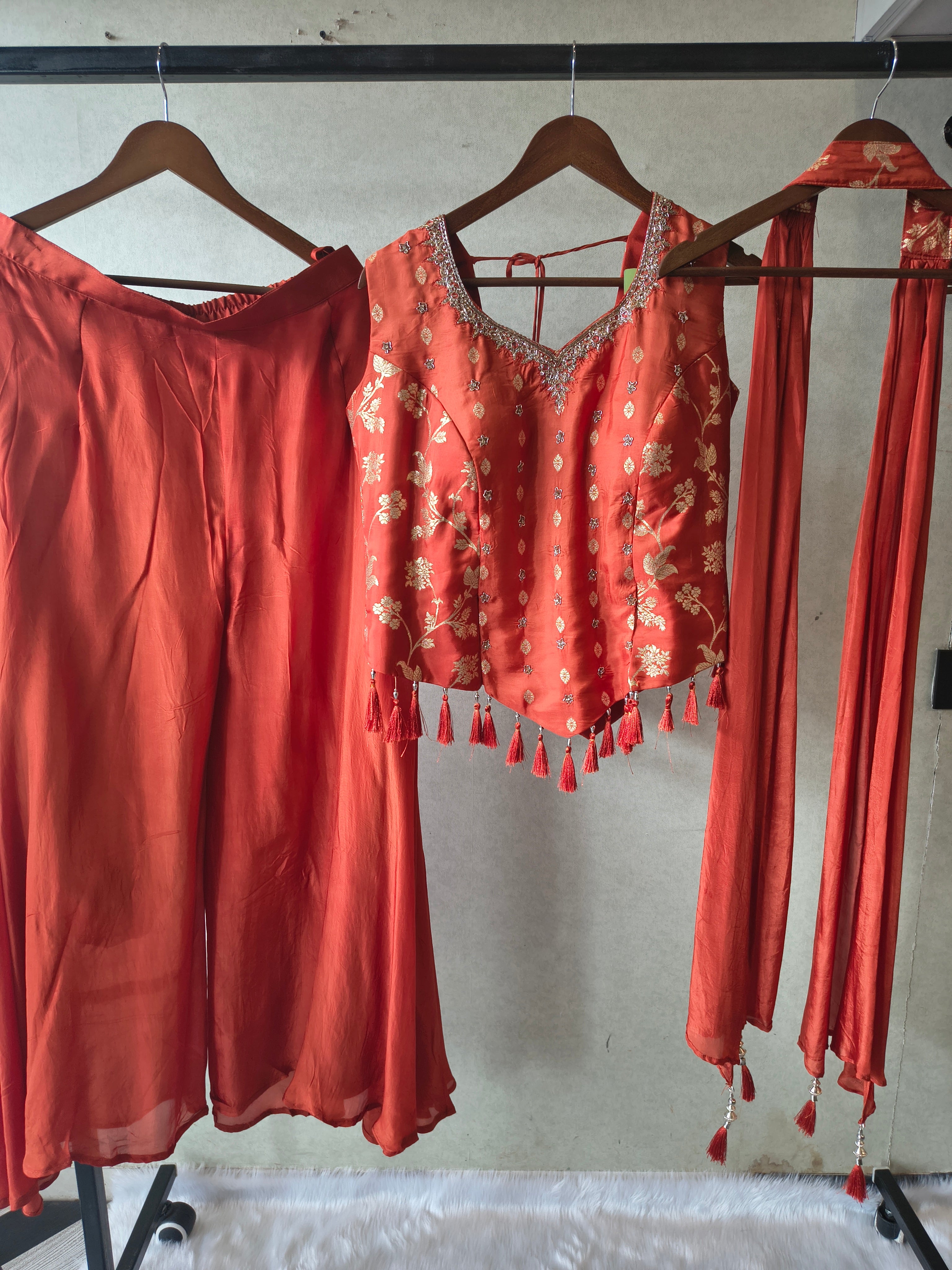 Image of Premium Rust Orange 3-Piece Designer Lehenga Set with Zari Embroidered Peplum Blouse & Tassel Dupatta