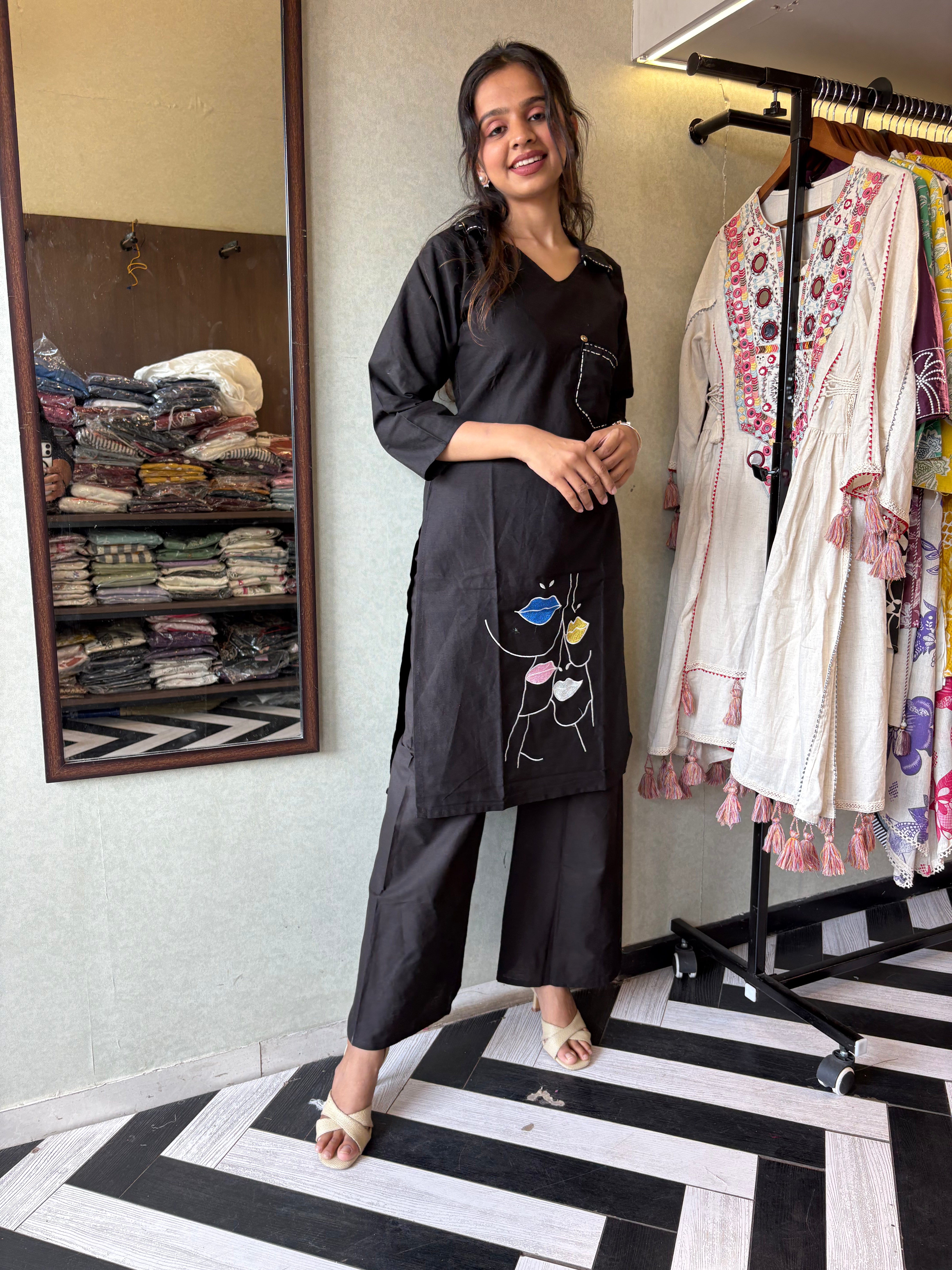 pure cotton black co-ord set, elevated with elegant embroidery detailing. It's a wardrobe must-have that looks premium