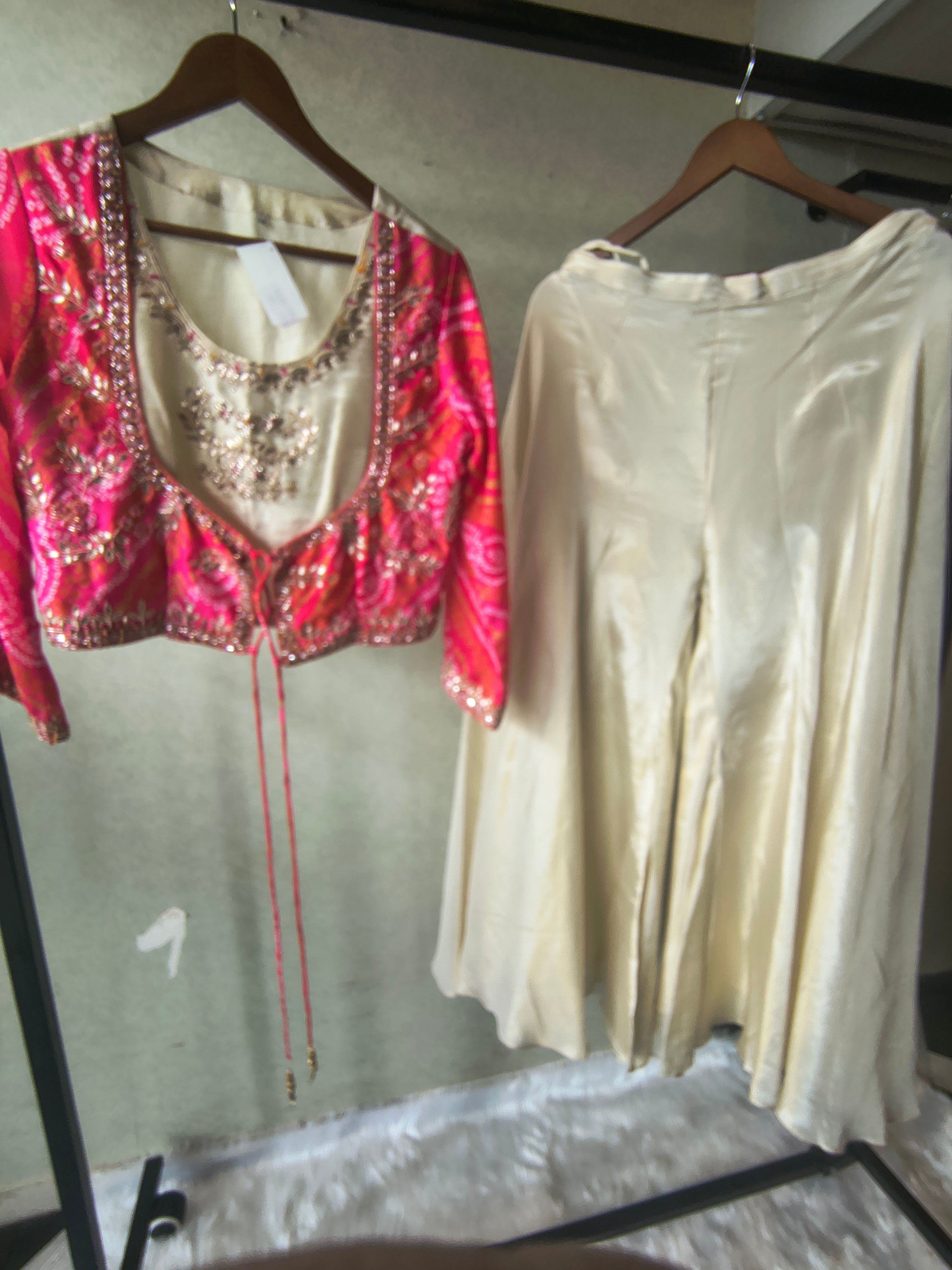 Image of Premium Hot Pink Bandhani Print Embroidered Jacket Blouse with Ivory Flared Palazzo Set