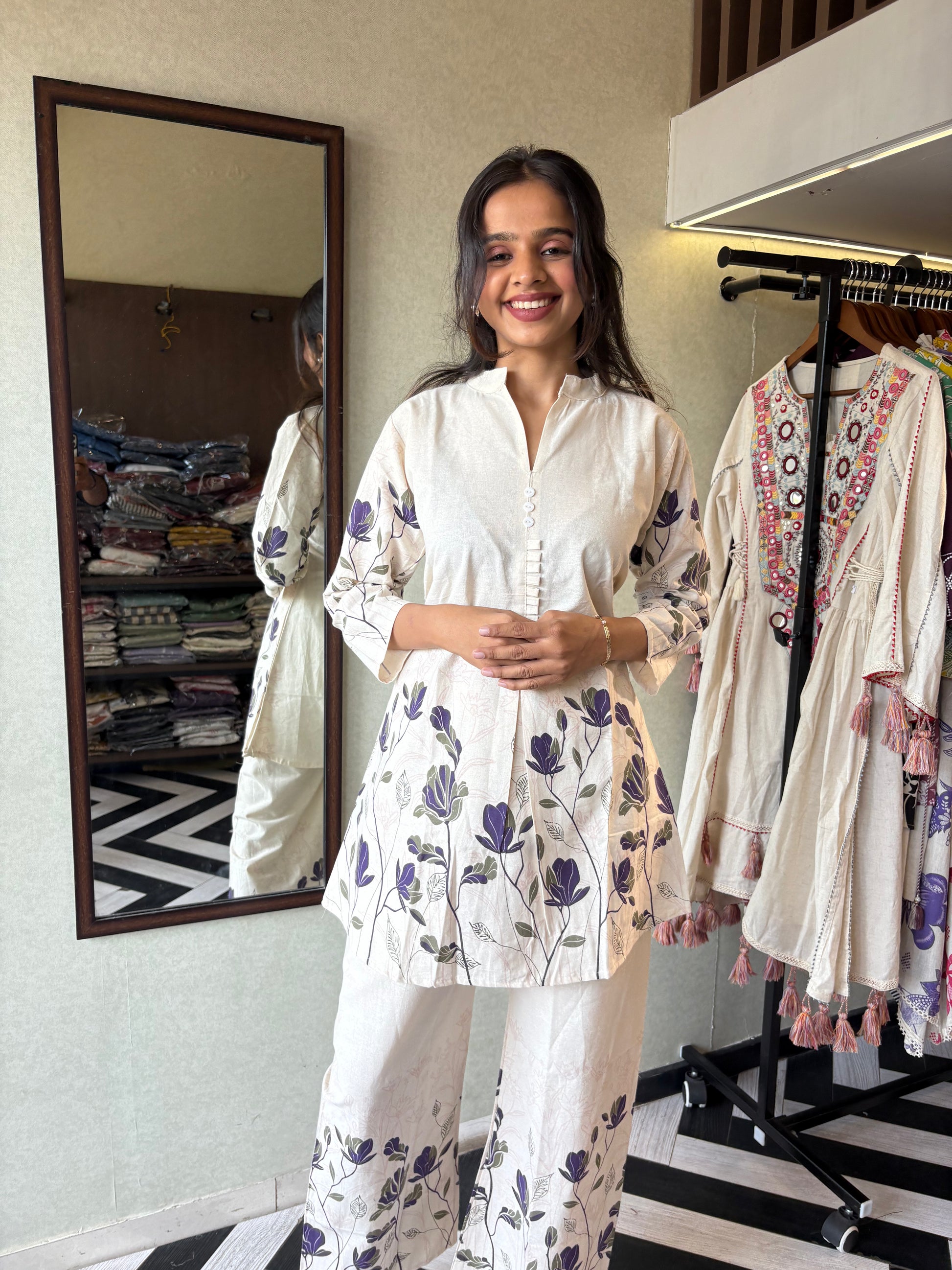 This pure cotton co-ord set in a designer white print is your summer savior - soft on the skin, bold on fashion