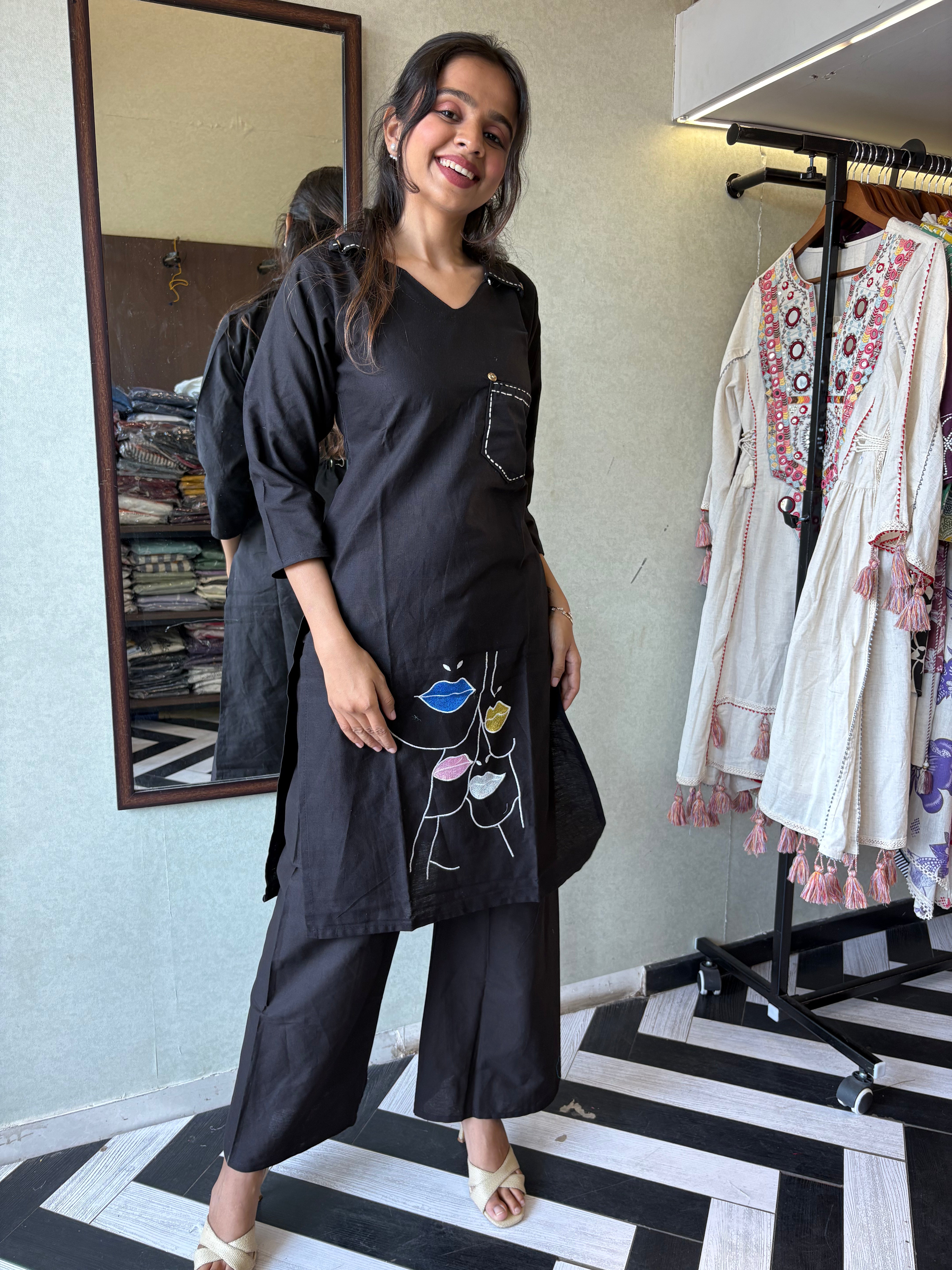 pure cotton black co-ord set, elevated with elegant embroidery detailing. It's a wardrobe must-have that looks premium