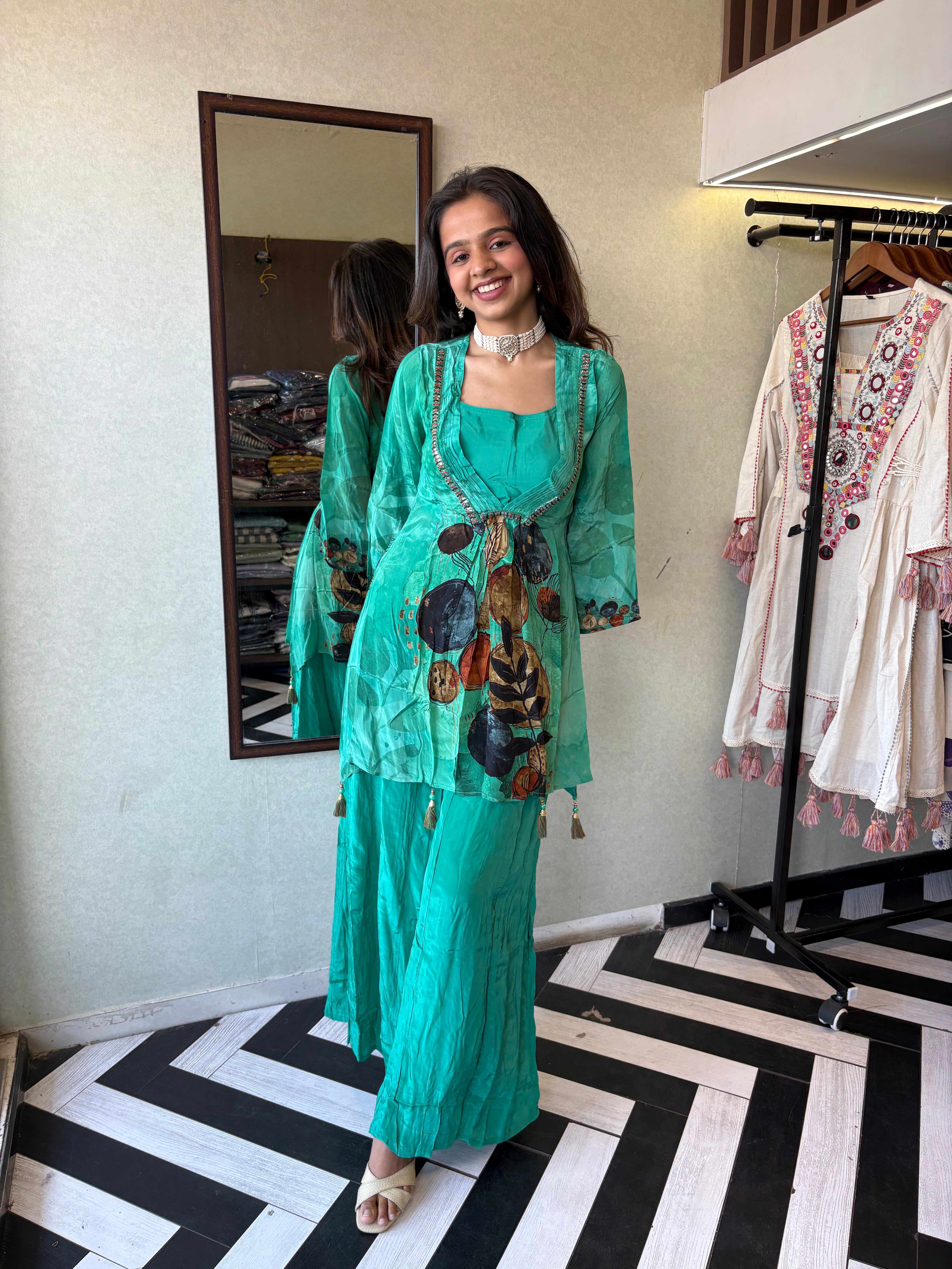 Image of Step into the celebration with our Designer Crepe 2-Piece Set in a refreshing green hue, crafted with intricate detailing and effortless grace