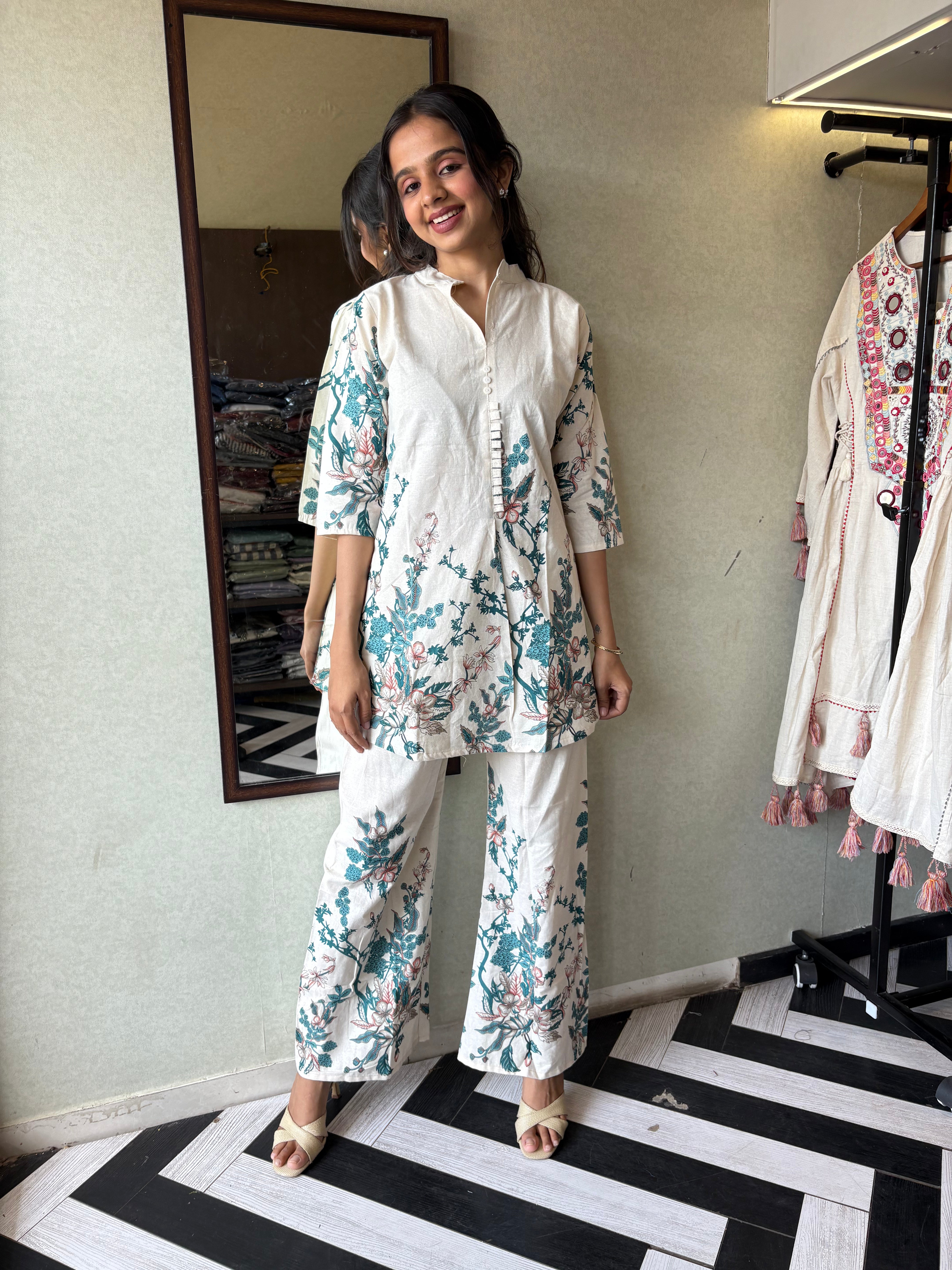 This pure cotton co-ord set in a designer white print is your summer savior - soft on the skin, bold on fashion