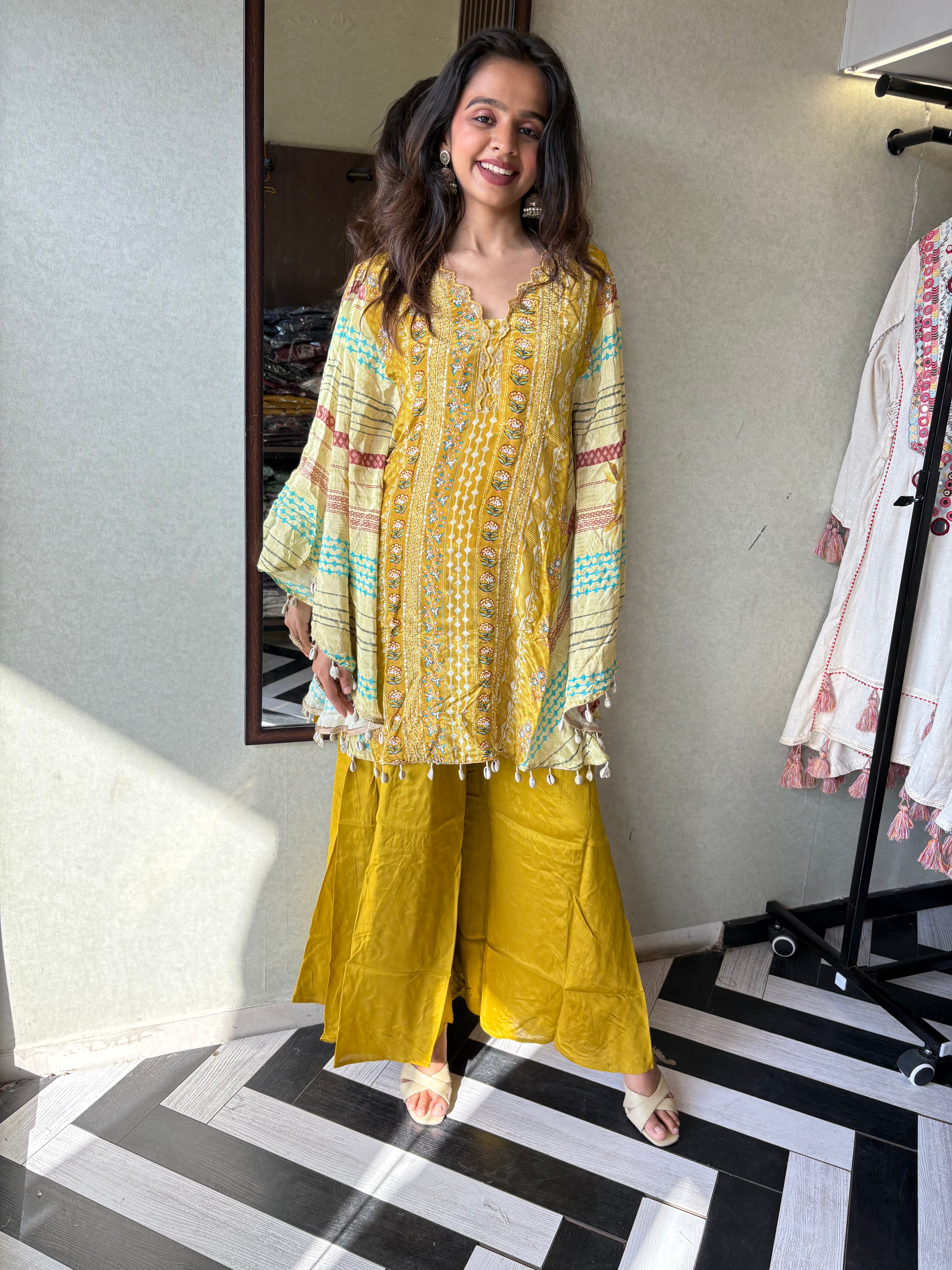 Image of Crafted from pure crepe fabric with hand-sequenced accessory work - it's the sunshine outfit your wardrobe needs!