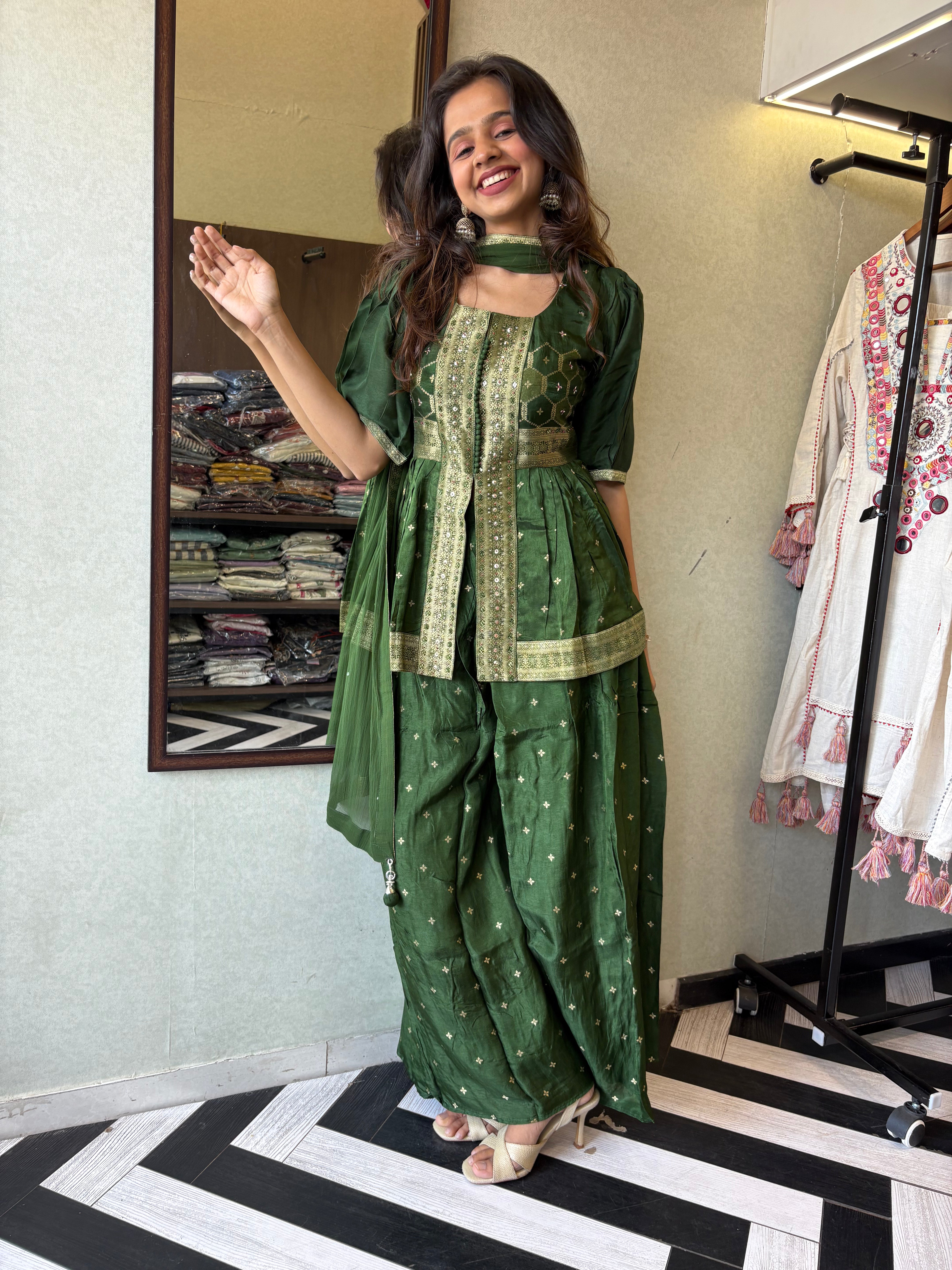 our premium pure silk 3-piece Indo-Western set in stunning green! From dazzling mirror & handwork on the jacket-style top to the flowing plazzo and dupatta