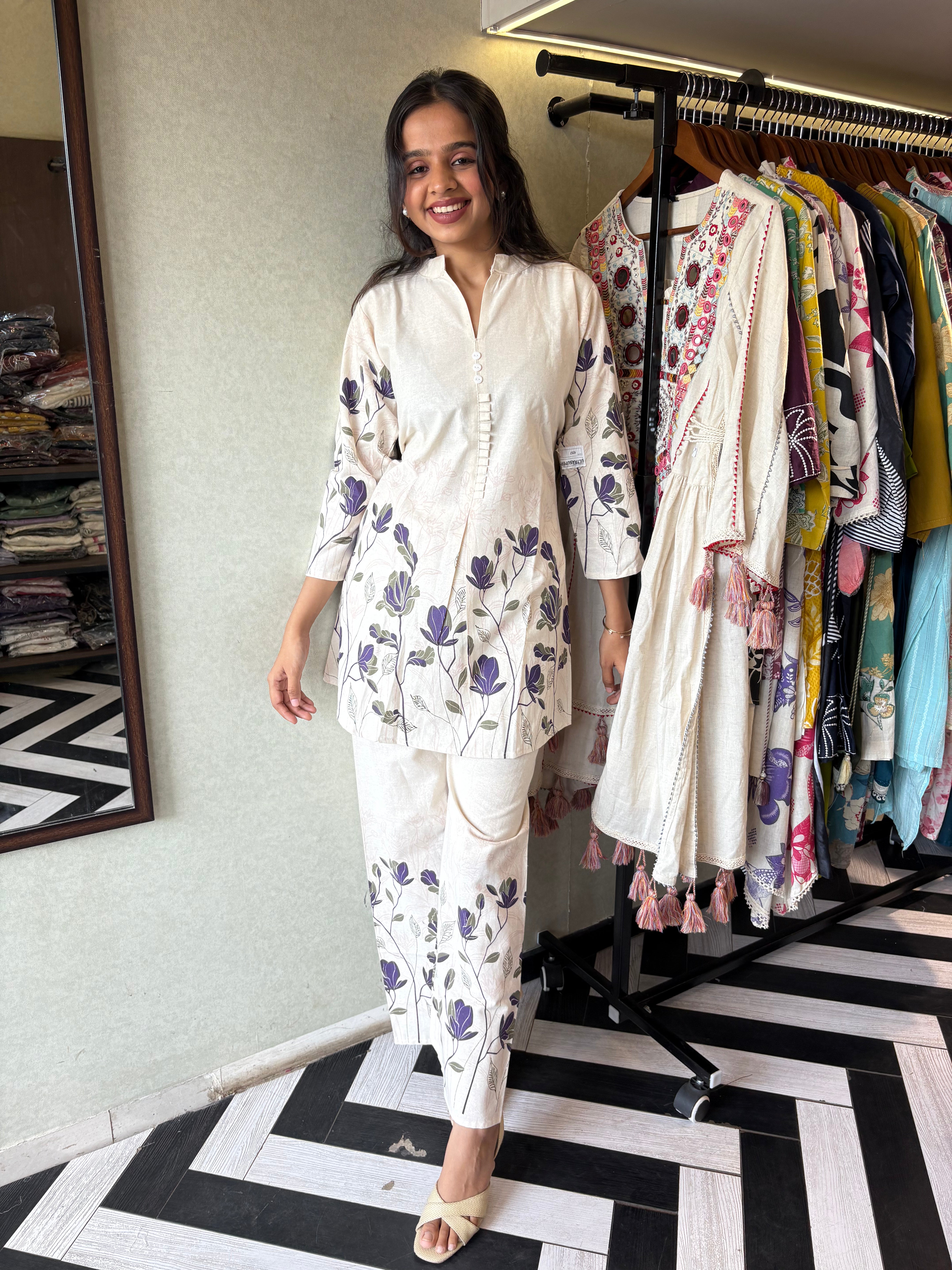 Image of This pure cotton co-ord set in a designer white print is your summer savior - soft on the skin, bold on fashion