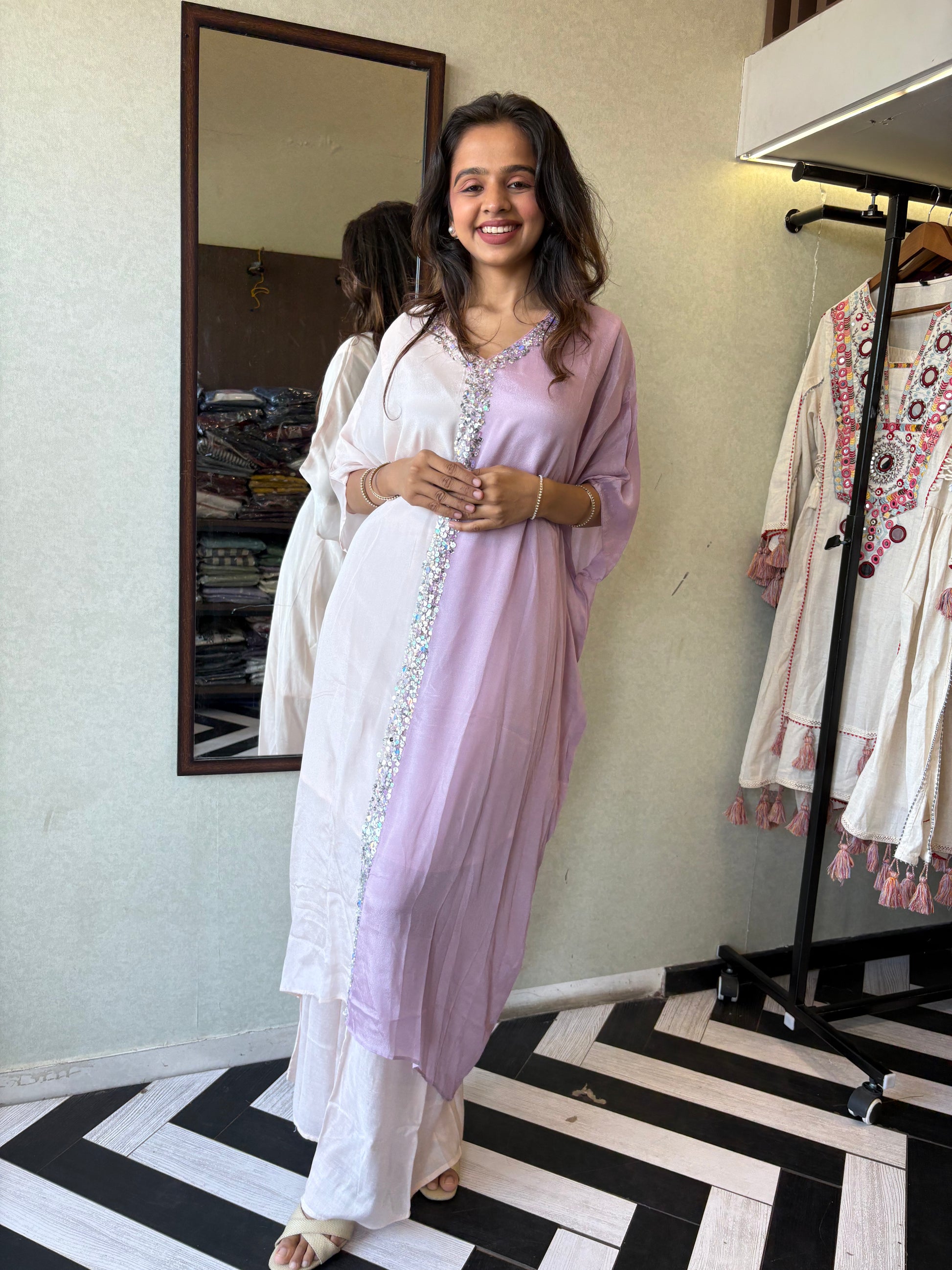 Turn heads in this elegant 3-piece Indo-Western beauty crafted from pure crepe with a silk base - featuring:

Gorgeous double-shade rose color

Center hand-sequence work that glistens with grace