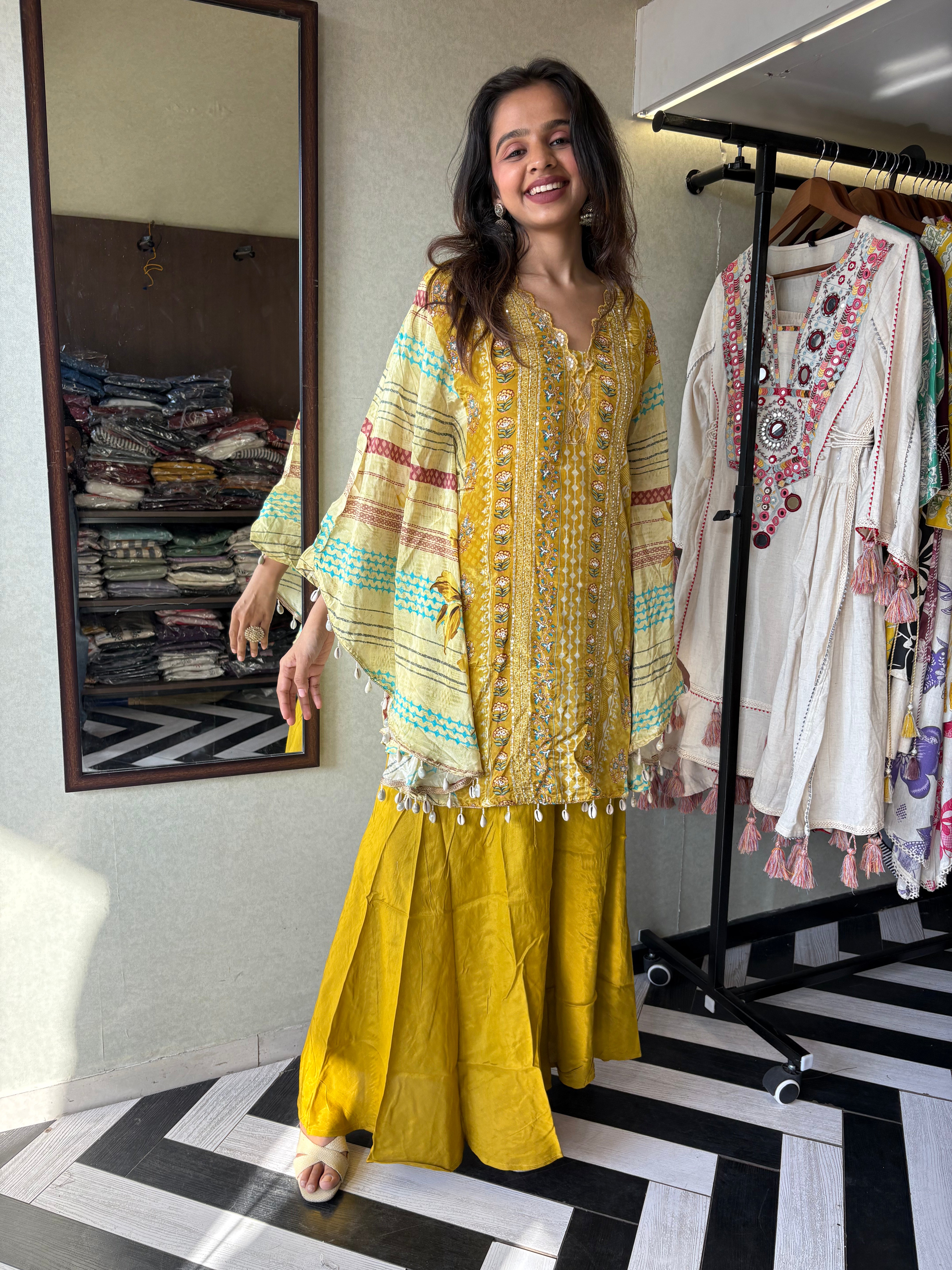 Crafted from pure crepe fabric with hand-sequenced accessory work - it's the sunshine outfit your wardrobe needs!