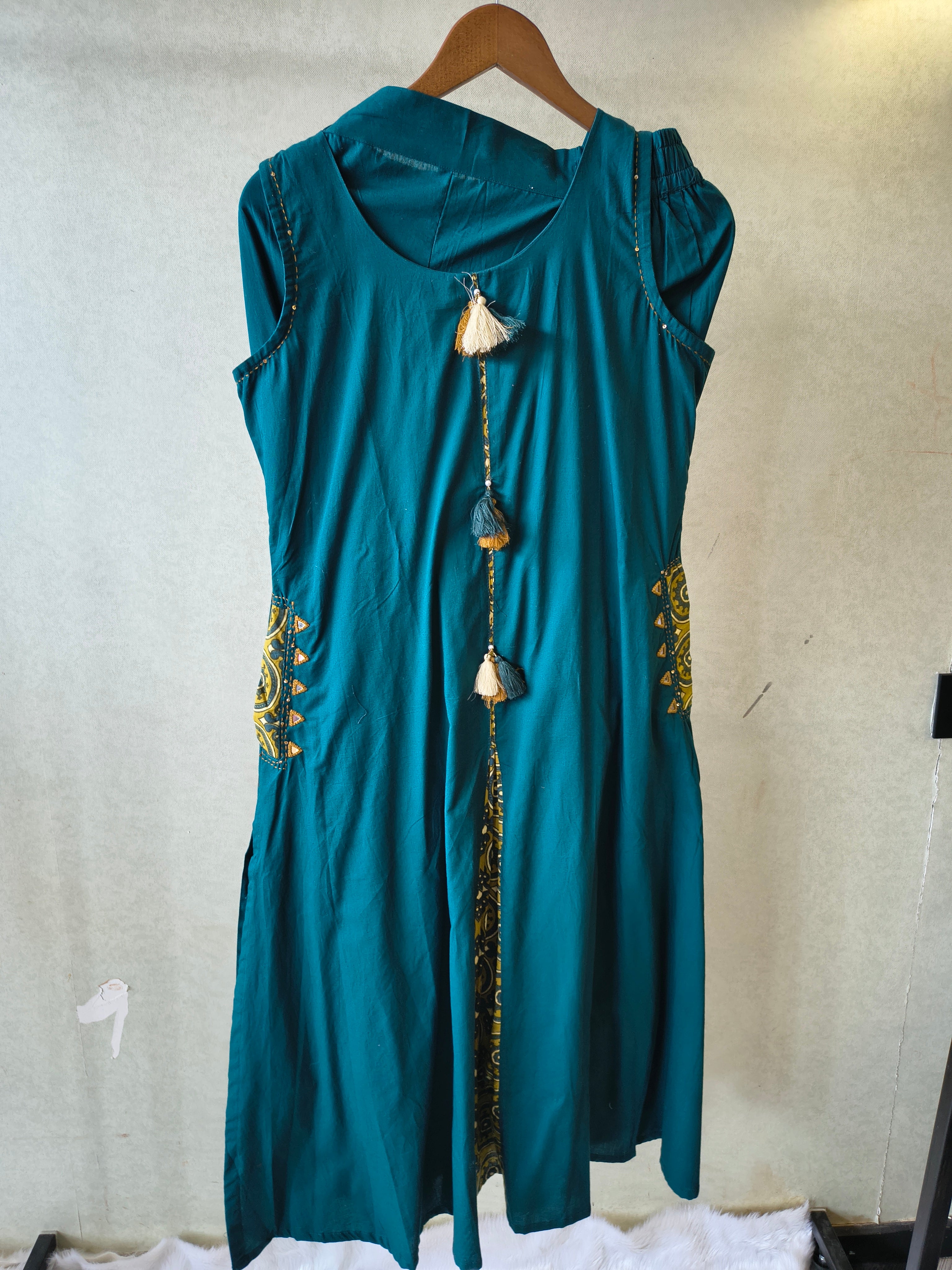 Image of Teal Sleeveless A-Line Kurta Set with Printed Panel & Straight Pants