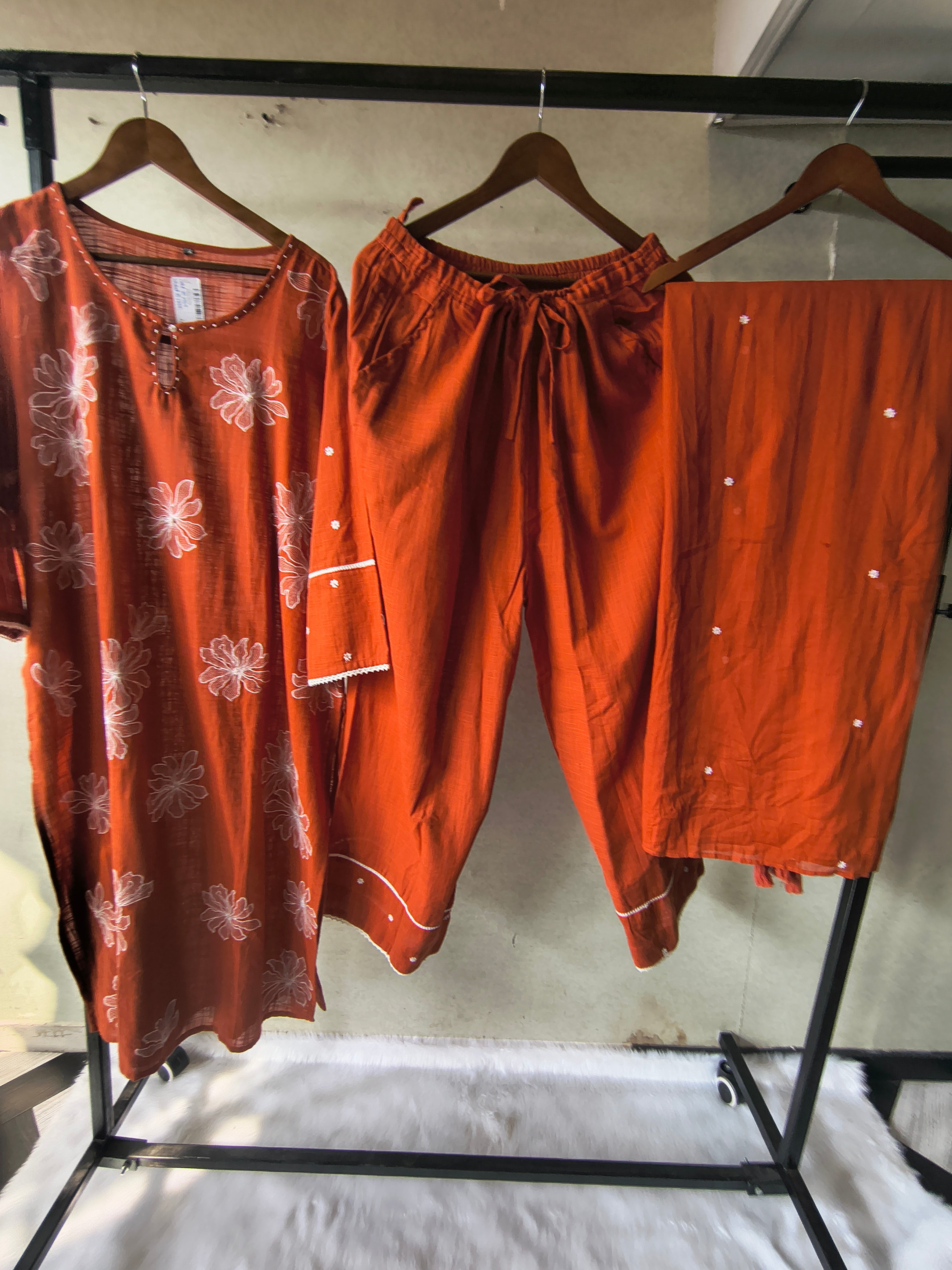 Image of Rust Orange Floral Printed Cotton Kurta Set with Solid Pants & Embroidered Dupatta