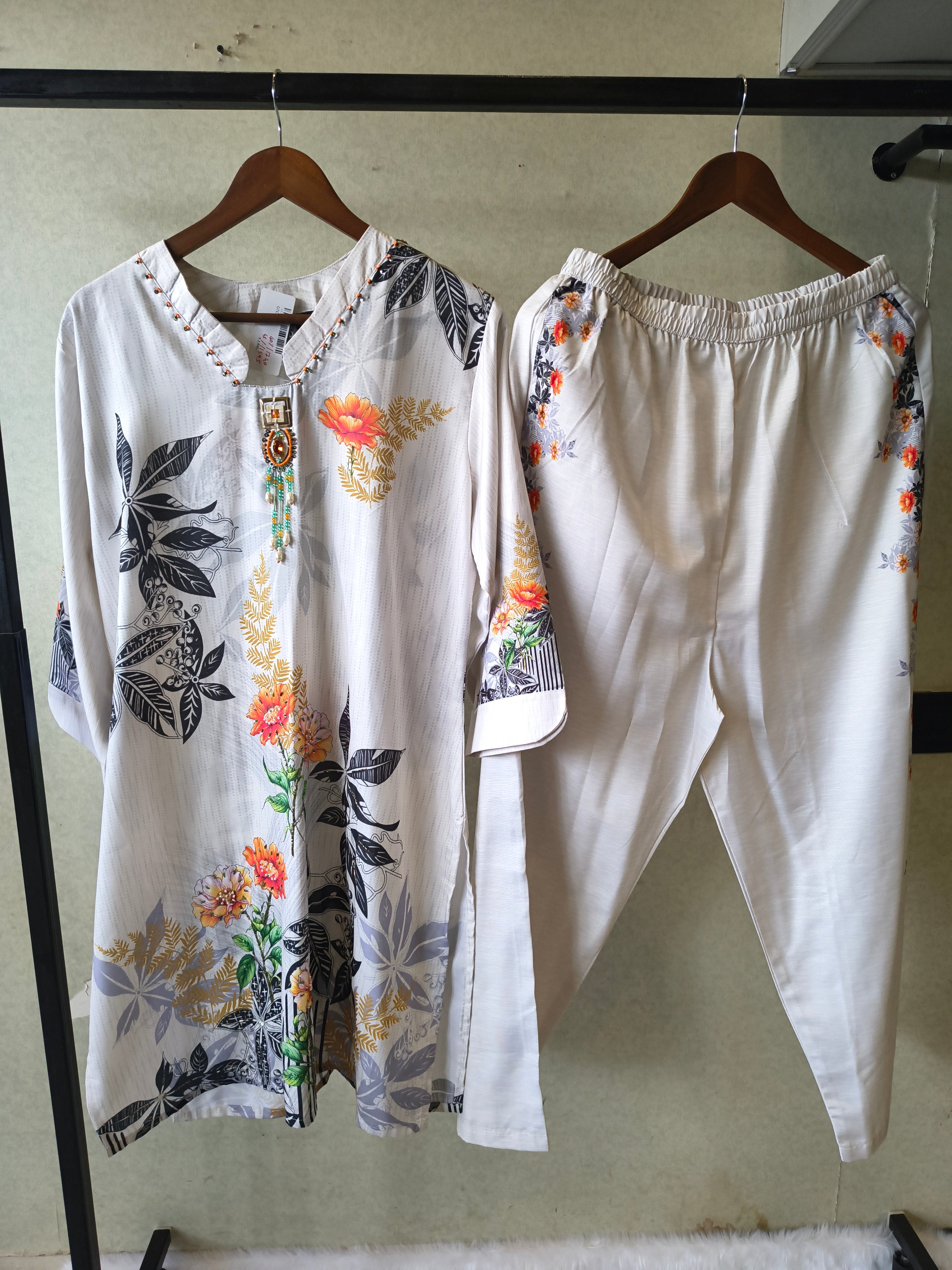 Image of Premium Ivory Botanical Printed Kurta Set with Designer Pendant Neckline